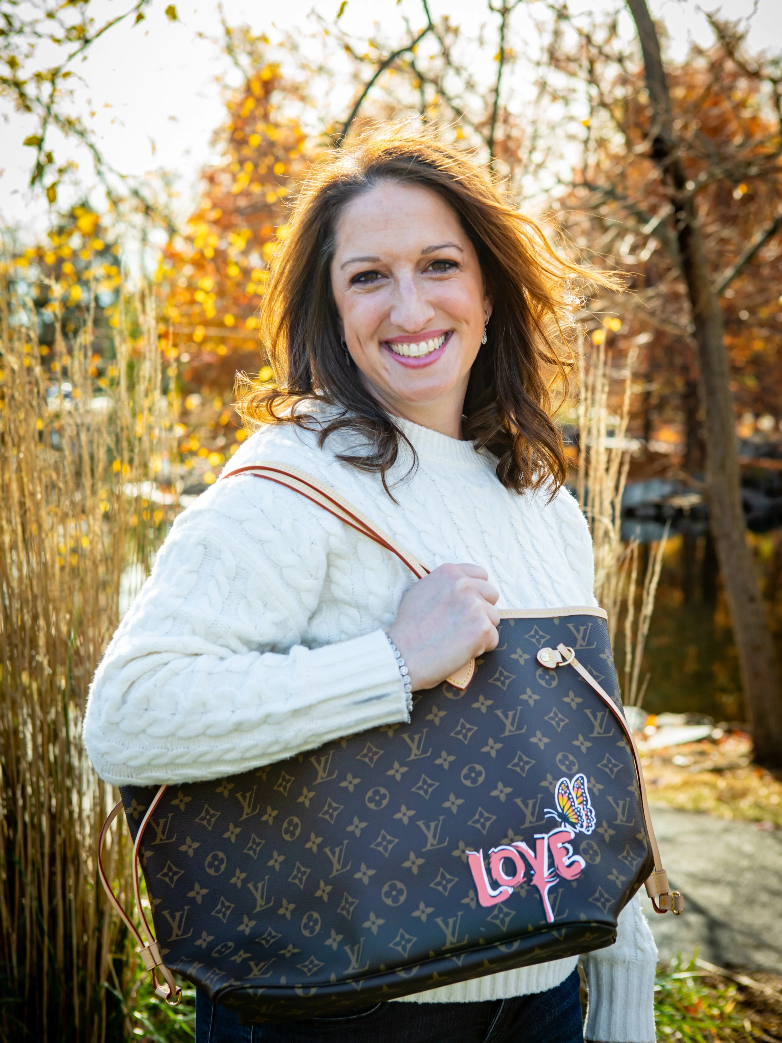 VIP gifting for Evolus. 80 Neverfull totes painted as Corporate Gifts and Incentive gifts painted by Michele Sobel Fine Art