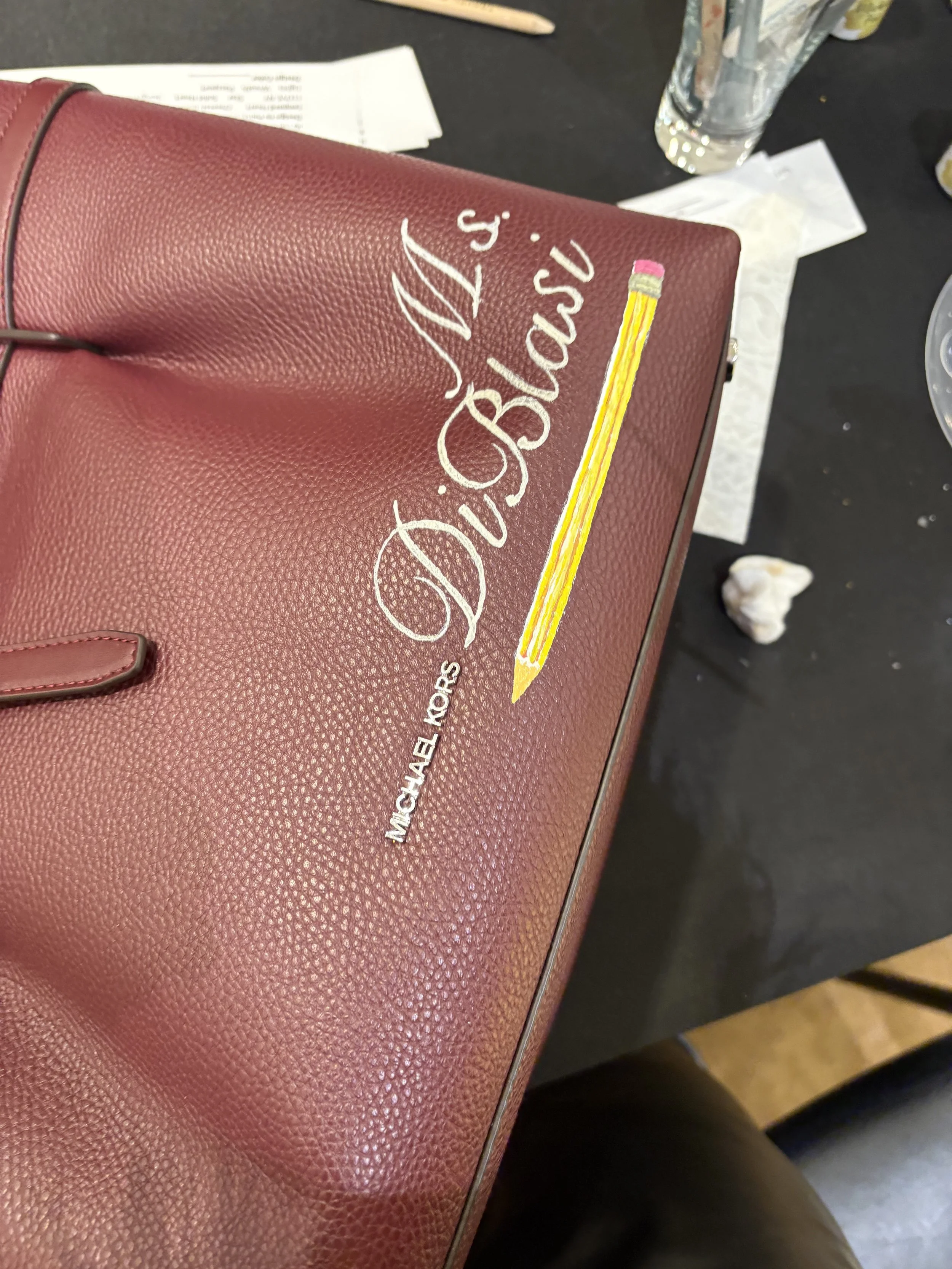 Hand-painted customization for Michael Kors at Macys Herald Square. Michele Sobel Fine art offered customers in stores bespoke designs, monograms and Michael Kors -inspired NYC, holiday and other custom art for a successful customization activation d
