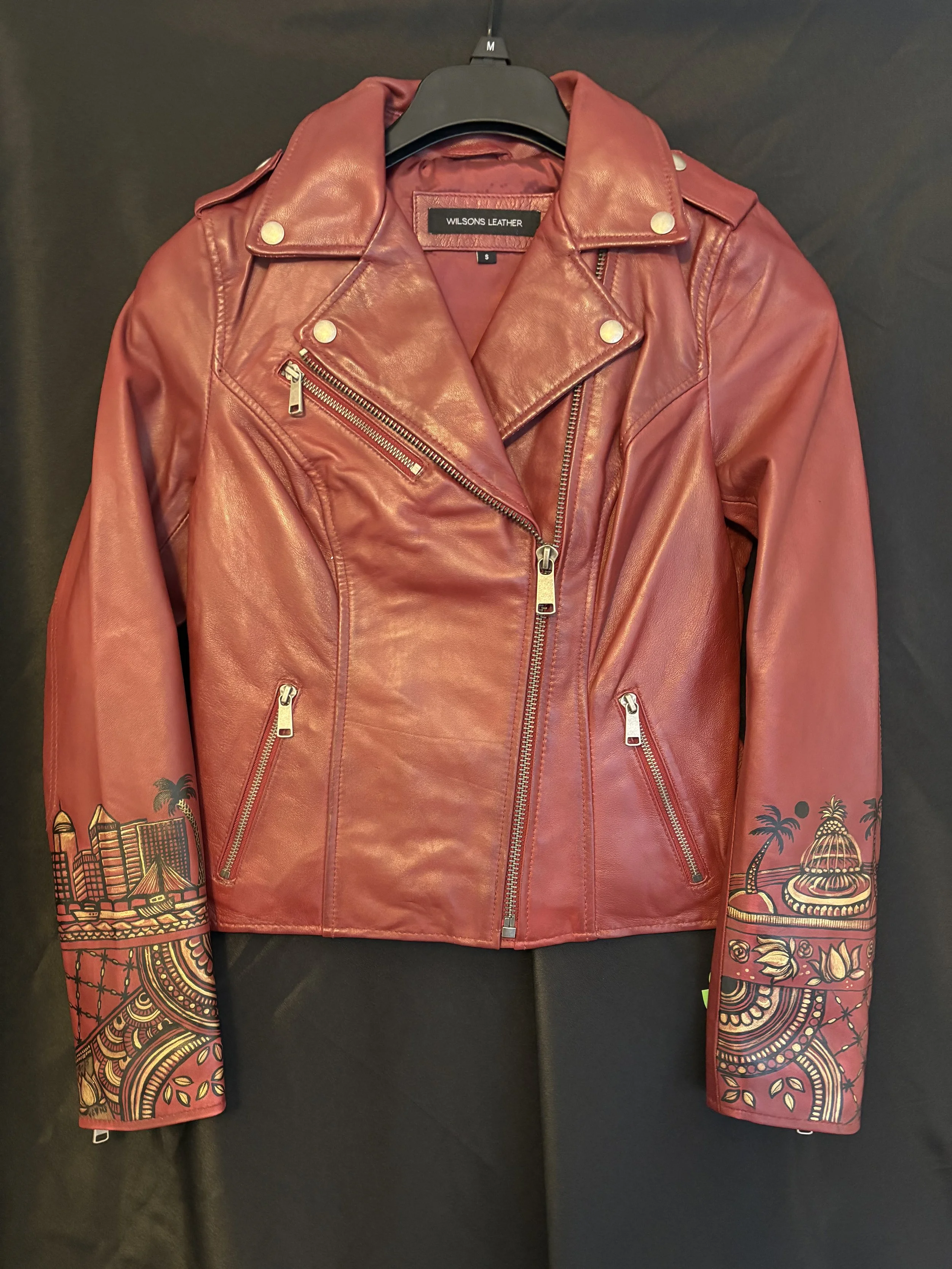 Leather jacket with painted designs inspired by her wedding Henna