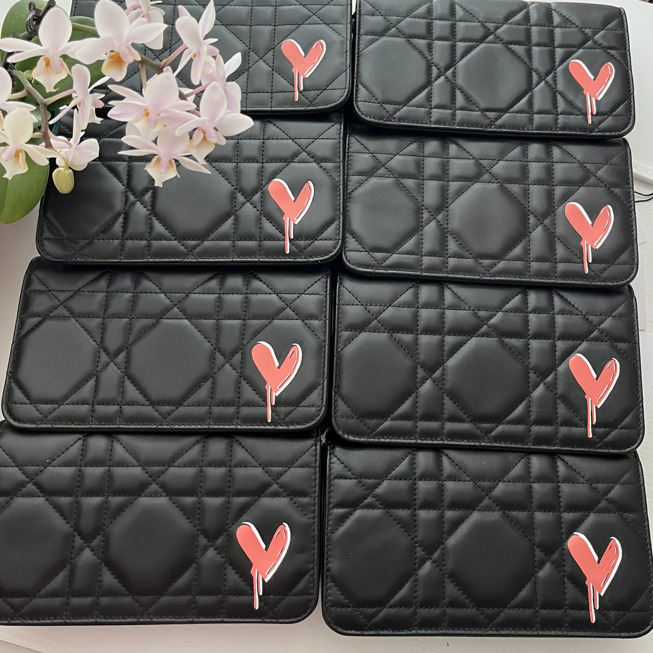 Custom painted branding for corporate gifting on Dior bags by Michele Sobel Fine Art