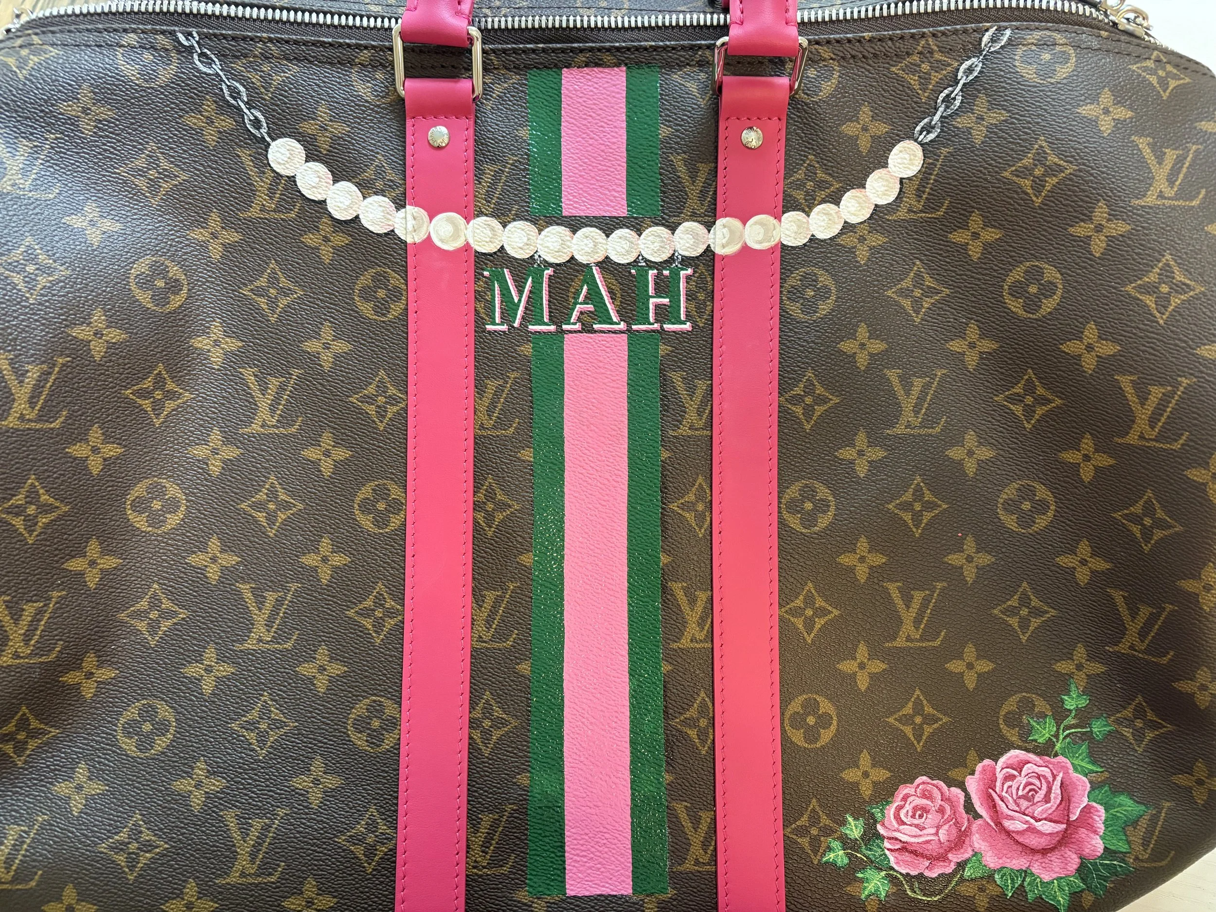 Stripes and a Monogram hanging from a hand-painted pearl chain along with tea roses to represent her sorority AKA. Painted by Michele Sobel Fine Art
