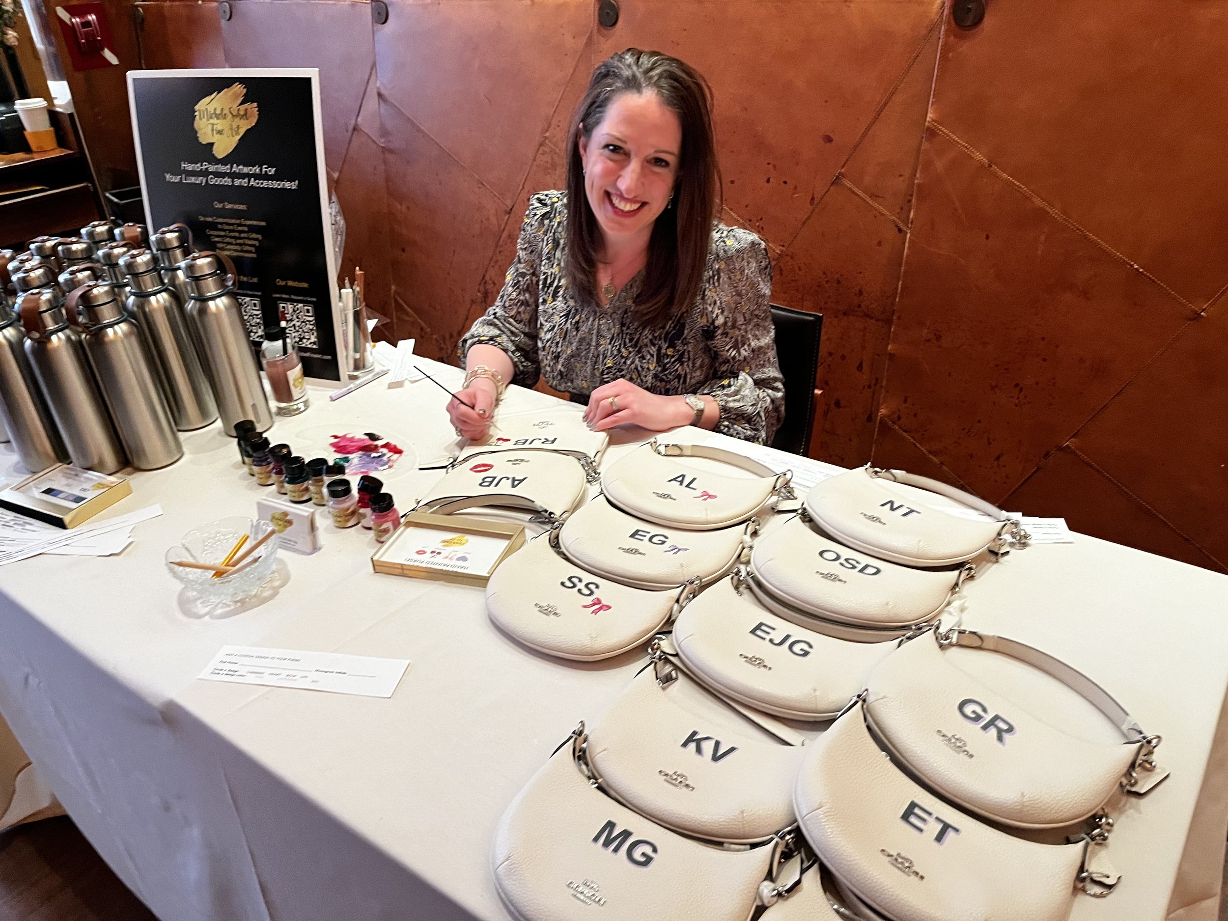 Hand painted handbags Bat Mitzvah swag for elegant event in NYC. we painted monograms and small designs on site. 