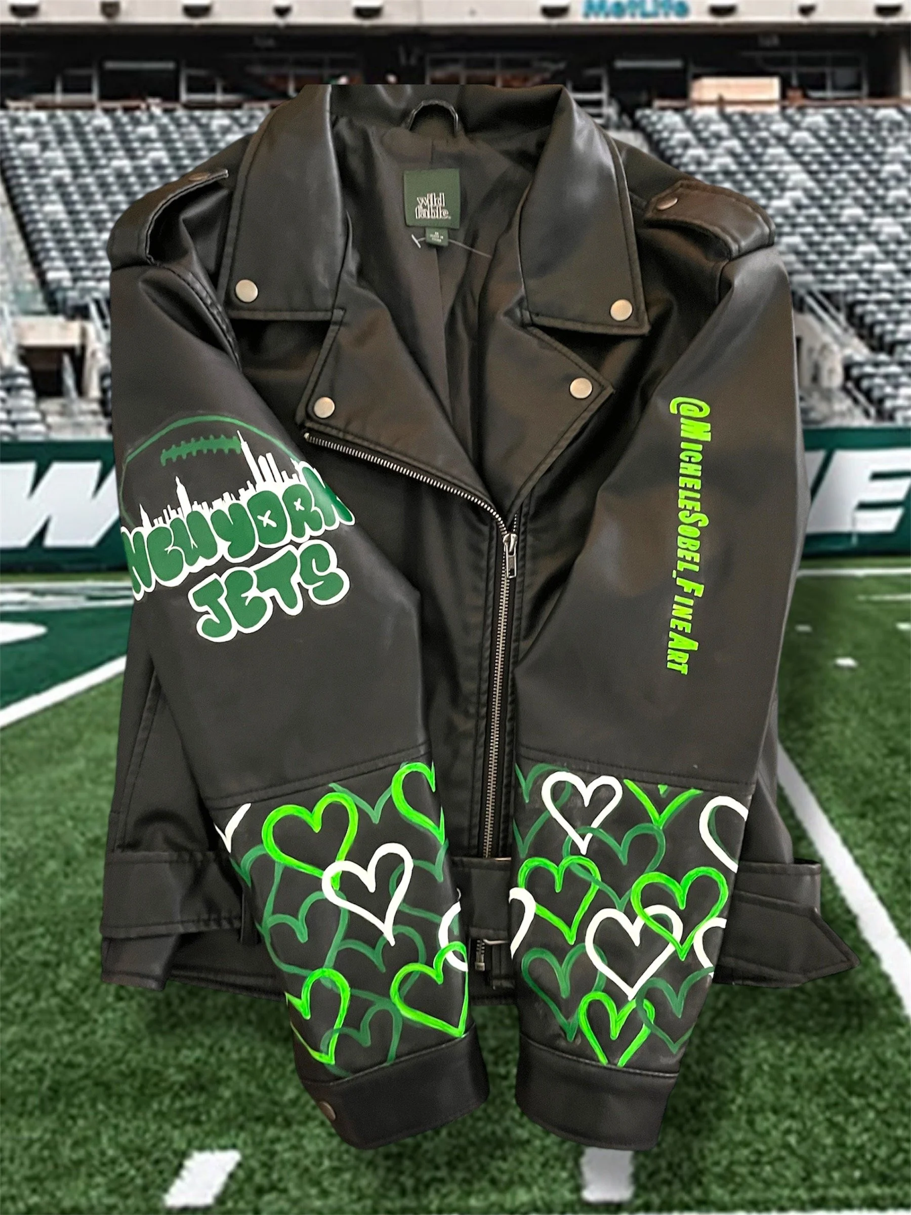 Jacket Michele Sobel Fine Art painted to paint on-site at the Jets training facility for a live customization event 