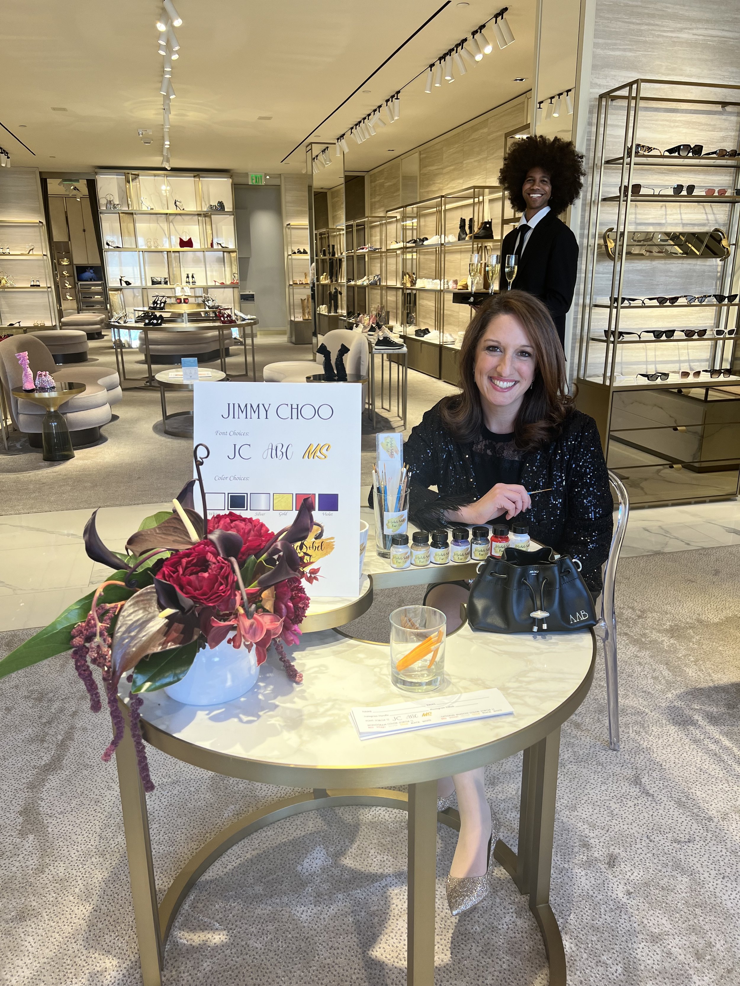 Bespoke hand painting activation for Jimmy Choo in Manhasset . Michele Sobel Fine Art handprinted shoes and bags for the luxury footwear and handbag brand.