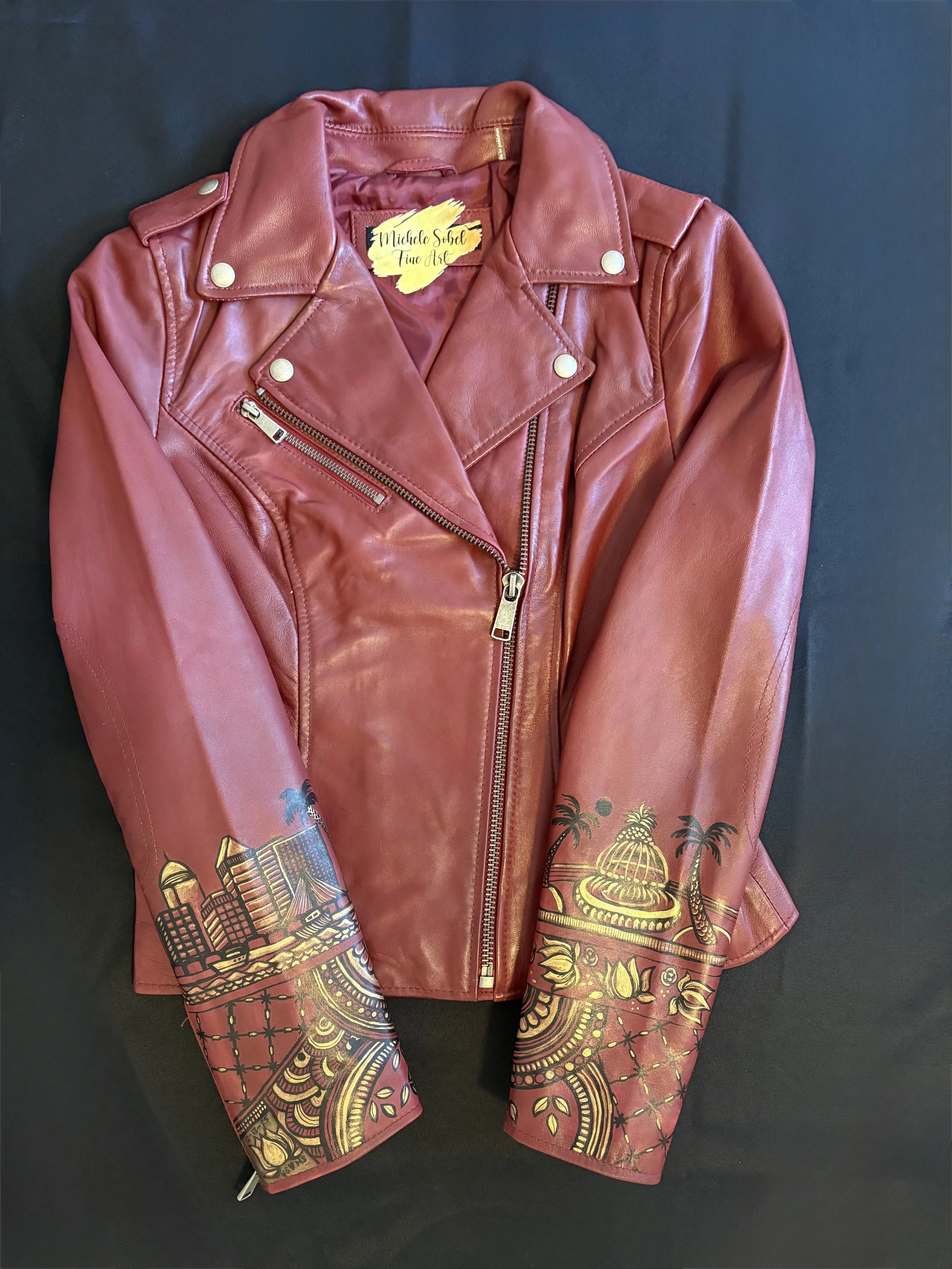 Leather jacket with painted designs inspired by her wedding Henna