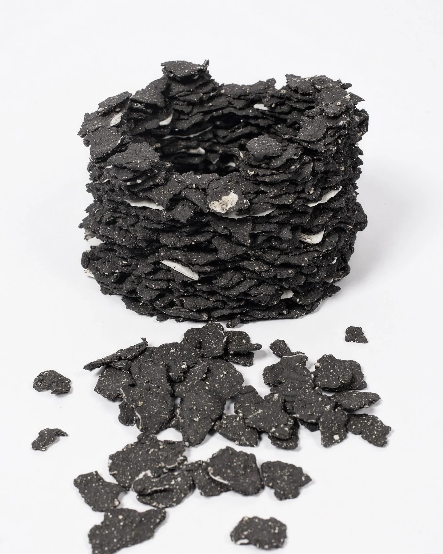 A maquette of black clay and porcelain, each piece of clay rubbed between my fingers, to go big would take a long time. The inspiration comes from Cotswold stone walling under the Ash trees. #maquette #sculpture #ceramicsculpture #blackclay #porcelai