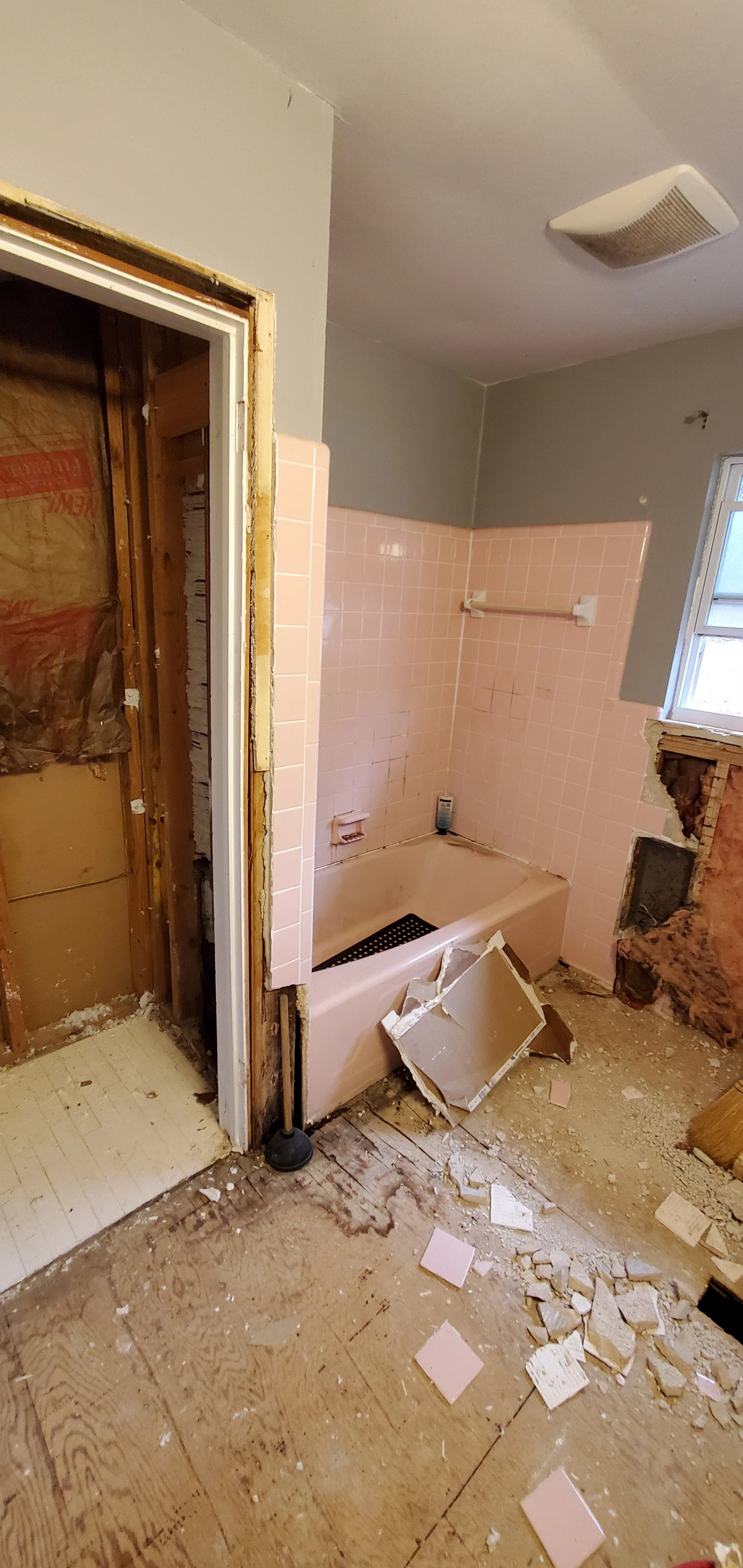 Guest bathroom remodel in Chattanooga, TN, showing pink tile and tub and old closet