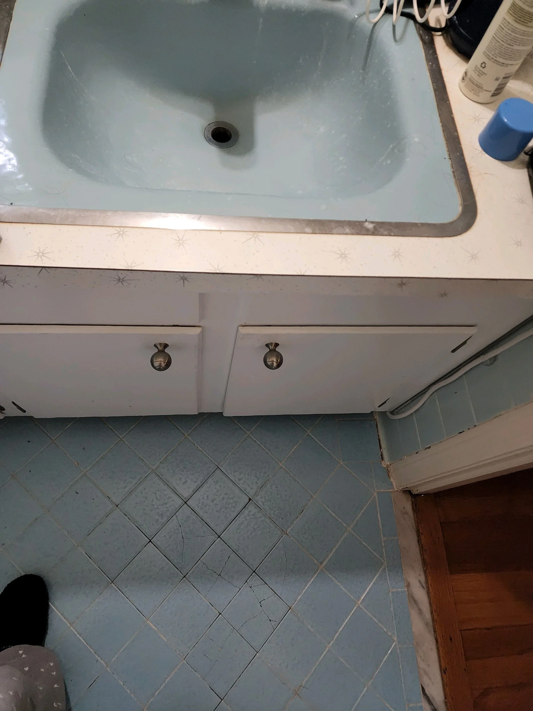 Master bath renovation in Chattanooga, TN, showing old sink and tile floor