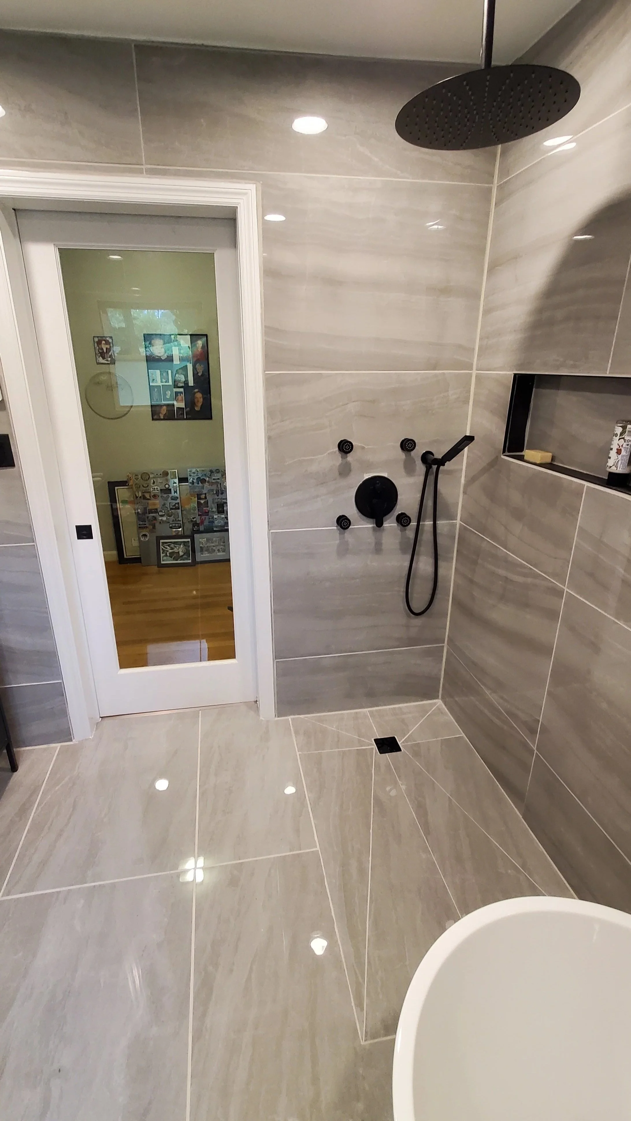 Guest bathroom remodel in Hixson, TN with heated floors, walk-in shower, body spray system, concrete sink