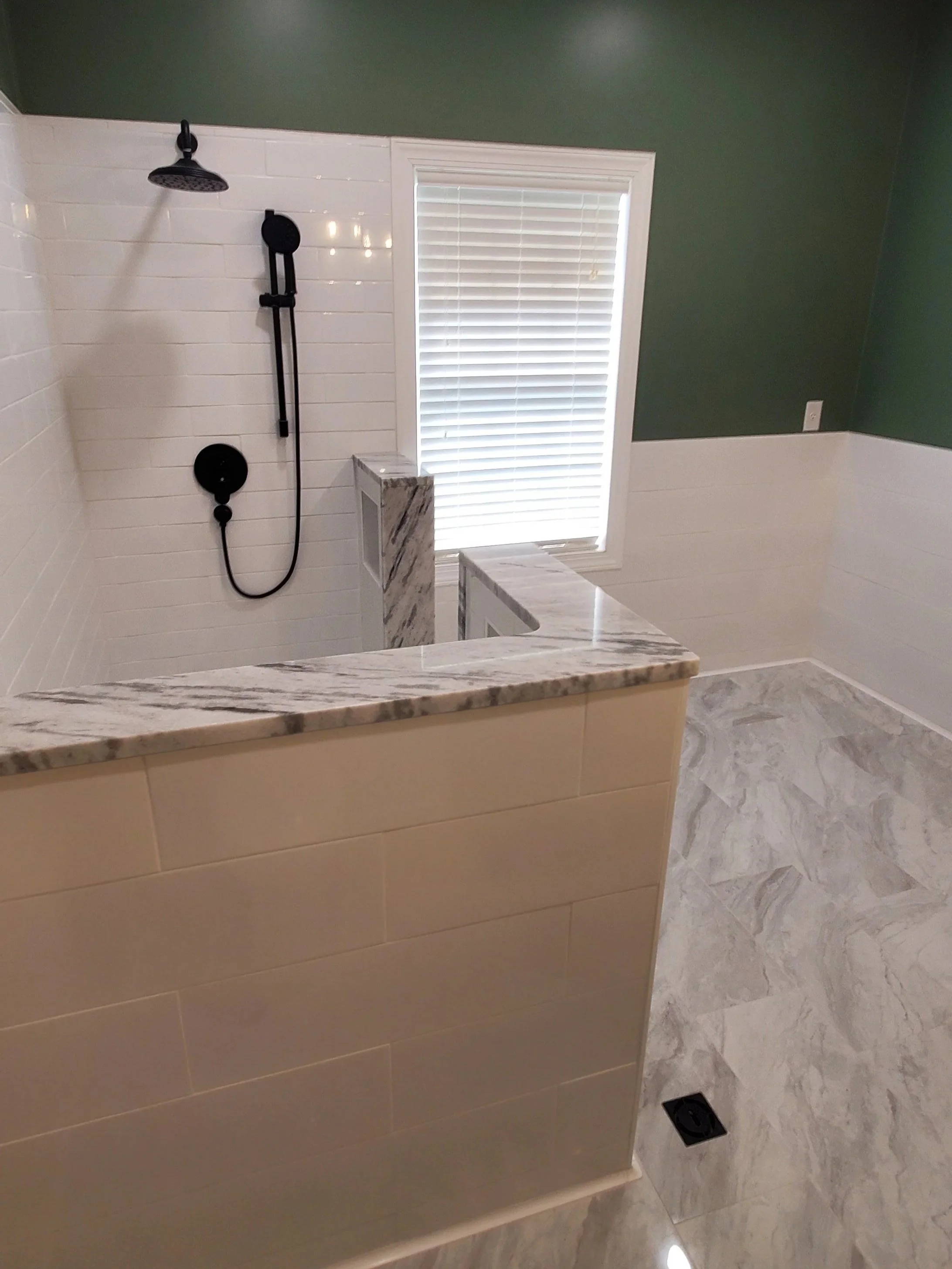 Bathroom remodel in Athens, TN showing new shower and where shower used to be