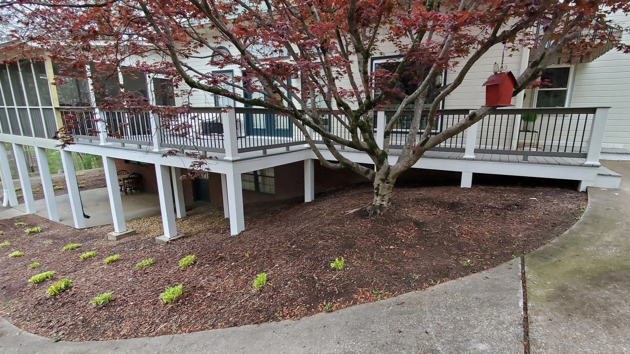 Deck rebuild in McDonald, TN with vinyl clad posts, composite deck boards, composite railings