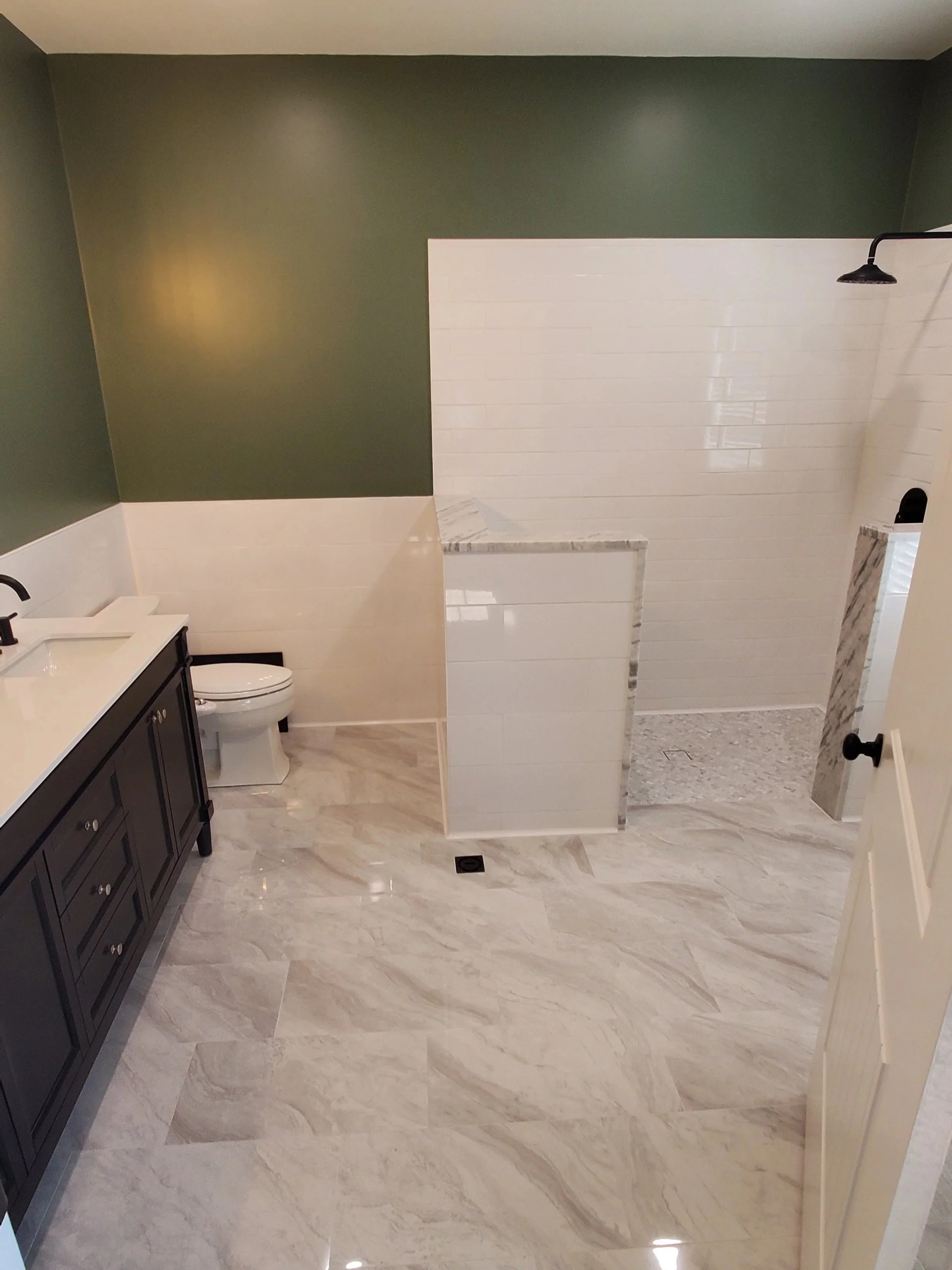 Bathroom after remodeling in Athens, TN vanity, toilet, and shower where tub used to be