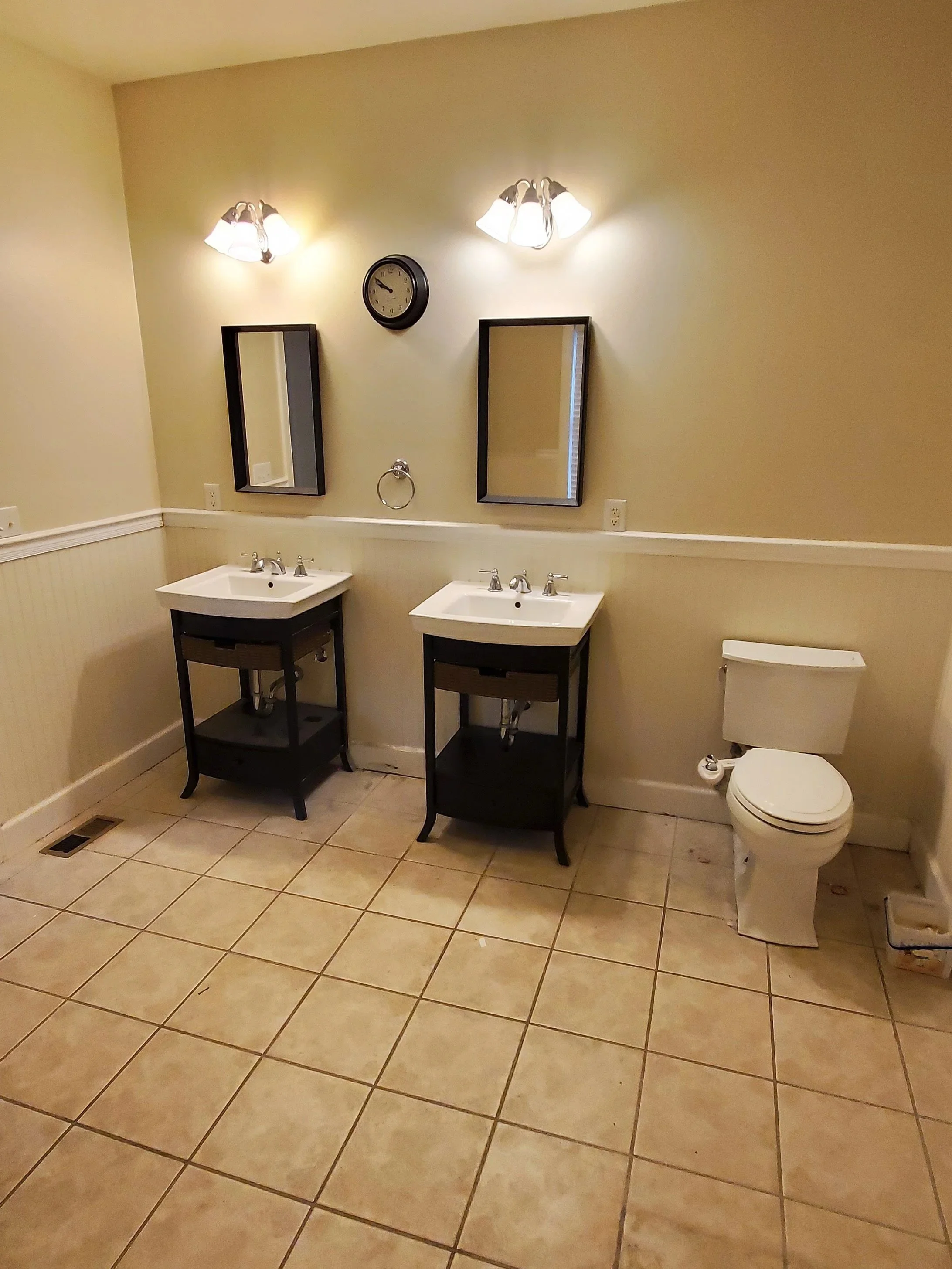 Bathroom remodel in Athens, TN showing vanities and toilet from inside old tub
