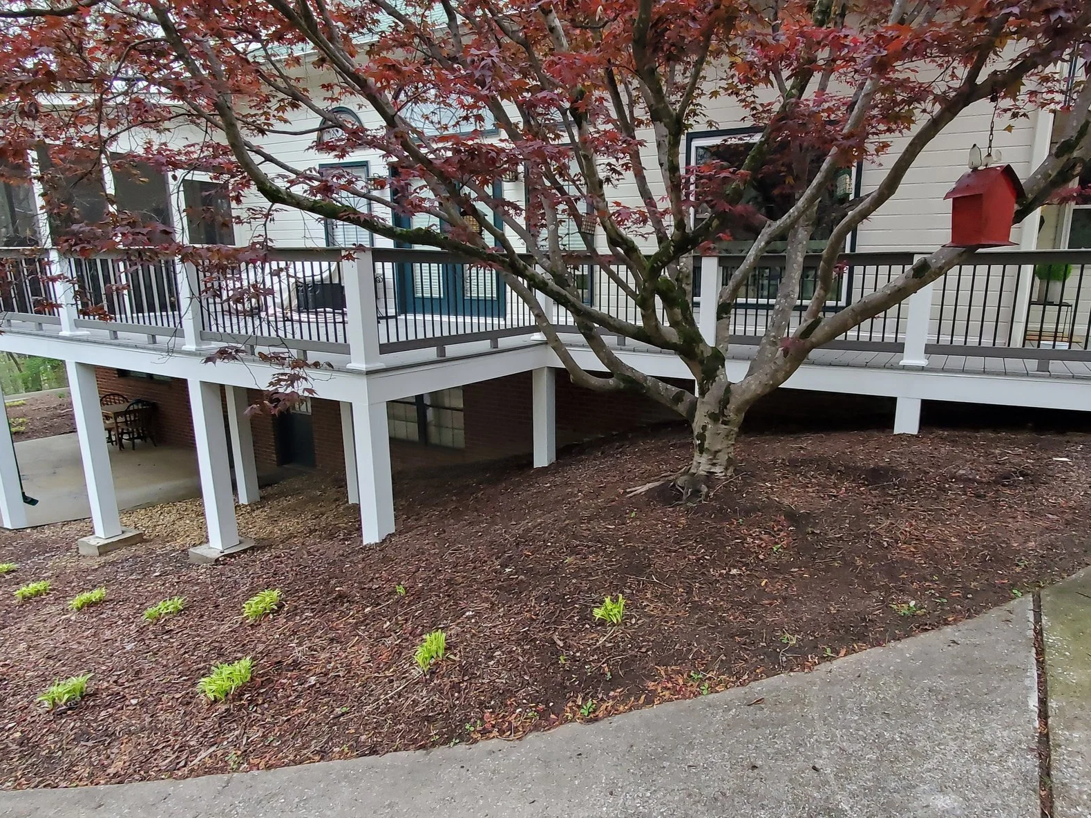 Deck rebuild in McDonald, TN, with vinyl clad posts, composite deck boards, composite railings