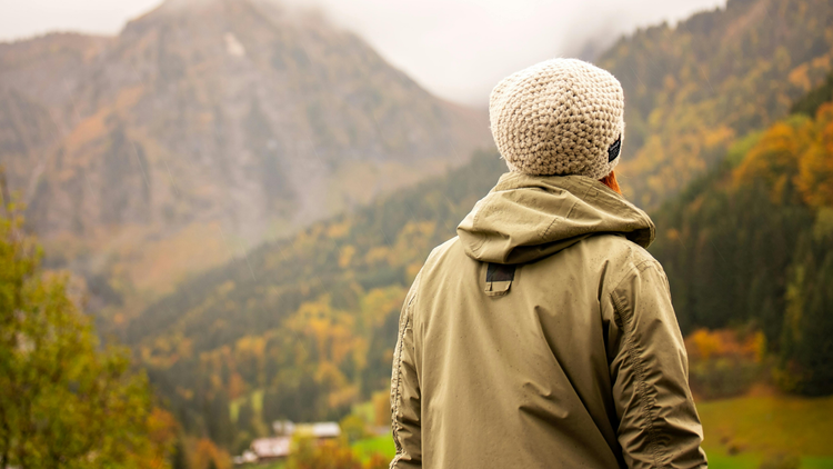 Client pausing to reflect on a mountain overlook