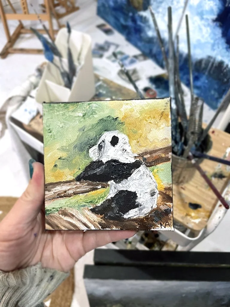 Mini Panda_Holding.jpg