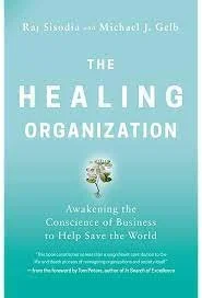 The cover of "The Healing Organization" book by Raj Sisodia and Michael J. Gelb, showing a blue-green gradient background with a small plant illustration. The subtitle reads, "Awakening the Conscience of Business to Help Save the World."