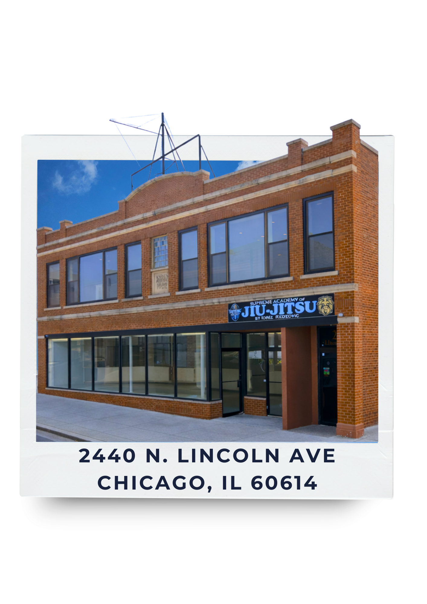Photo of a brick building with large windows, a sign for Samurai Academy of Jiu-Jitsu, located at 2440 N. Lincoln Ave, Chicago, IL 60614.