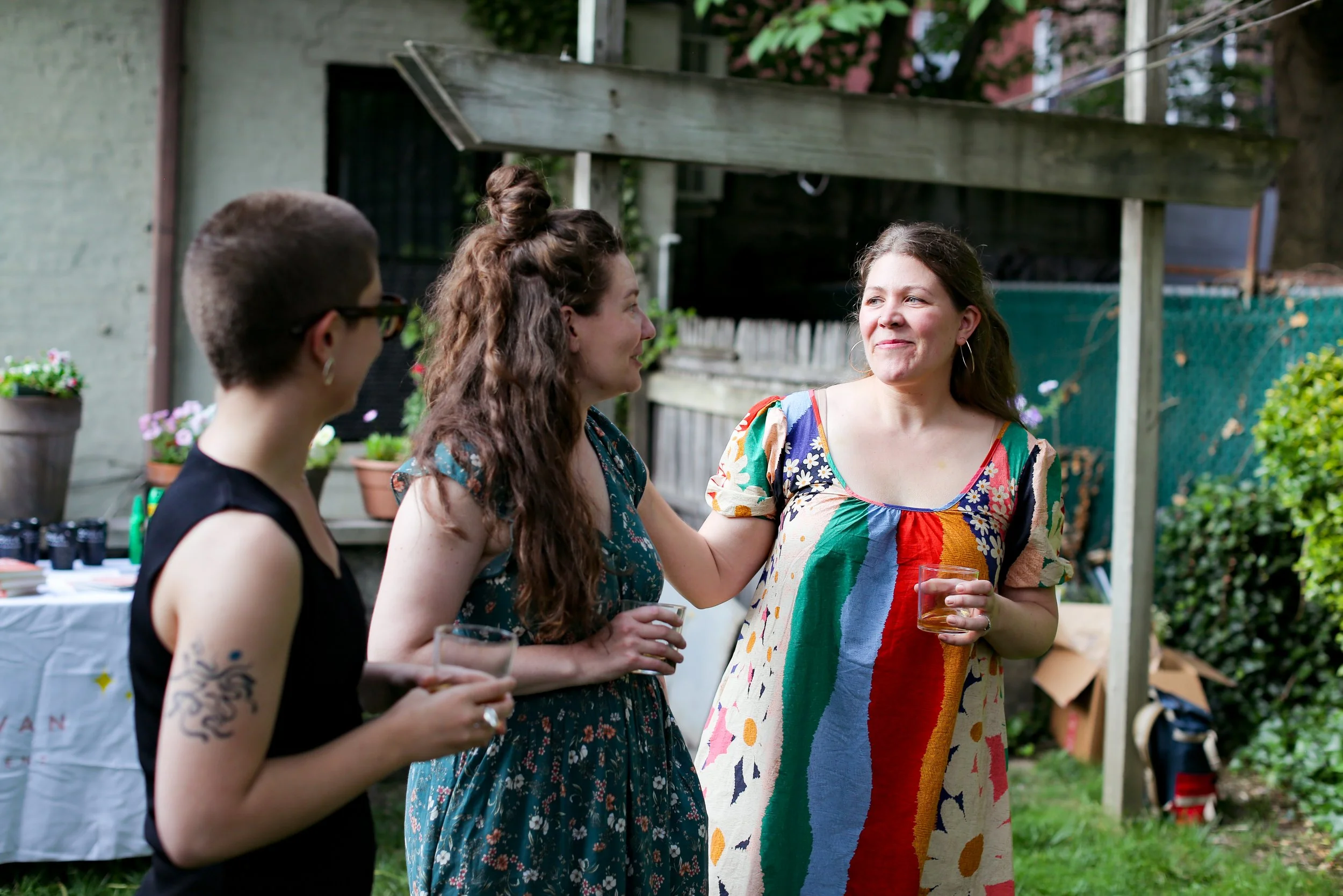 A diverse group of doulas connecting and networking at an outdoor community event, representing Baby Caravan's inclusive collective of birth and postpartum doulas serving New York City metro area families.