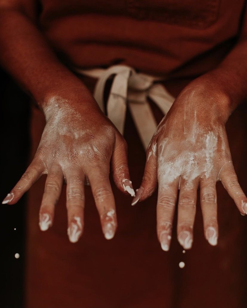 Left: A potter’s hands. Photo by Alexandra Wallace.