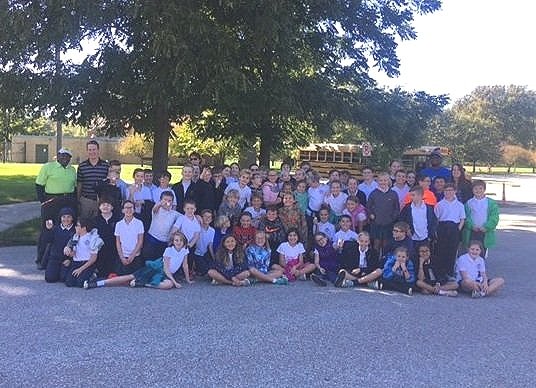 A group photo of kids who attended a golf clinic.