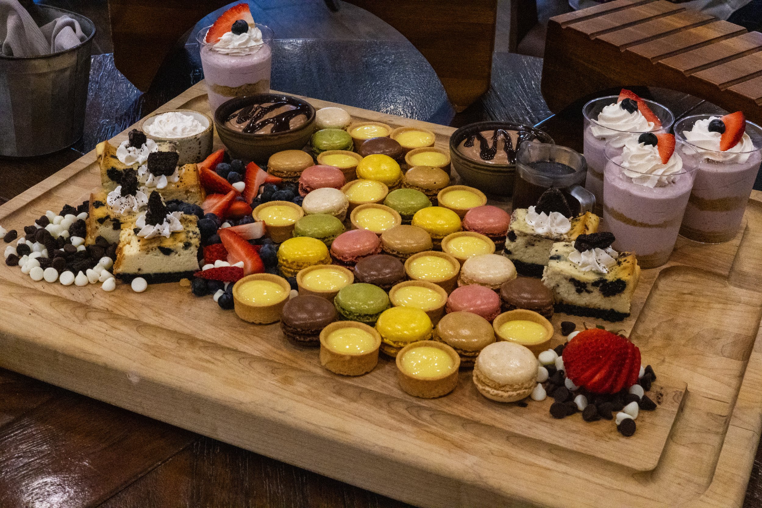 A dessert spread, including macarons and mousse.