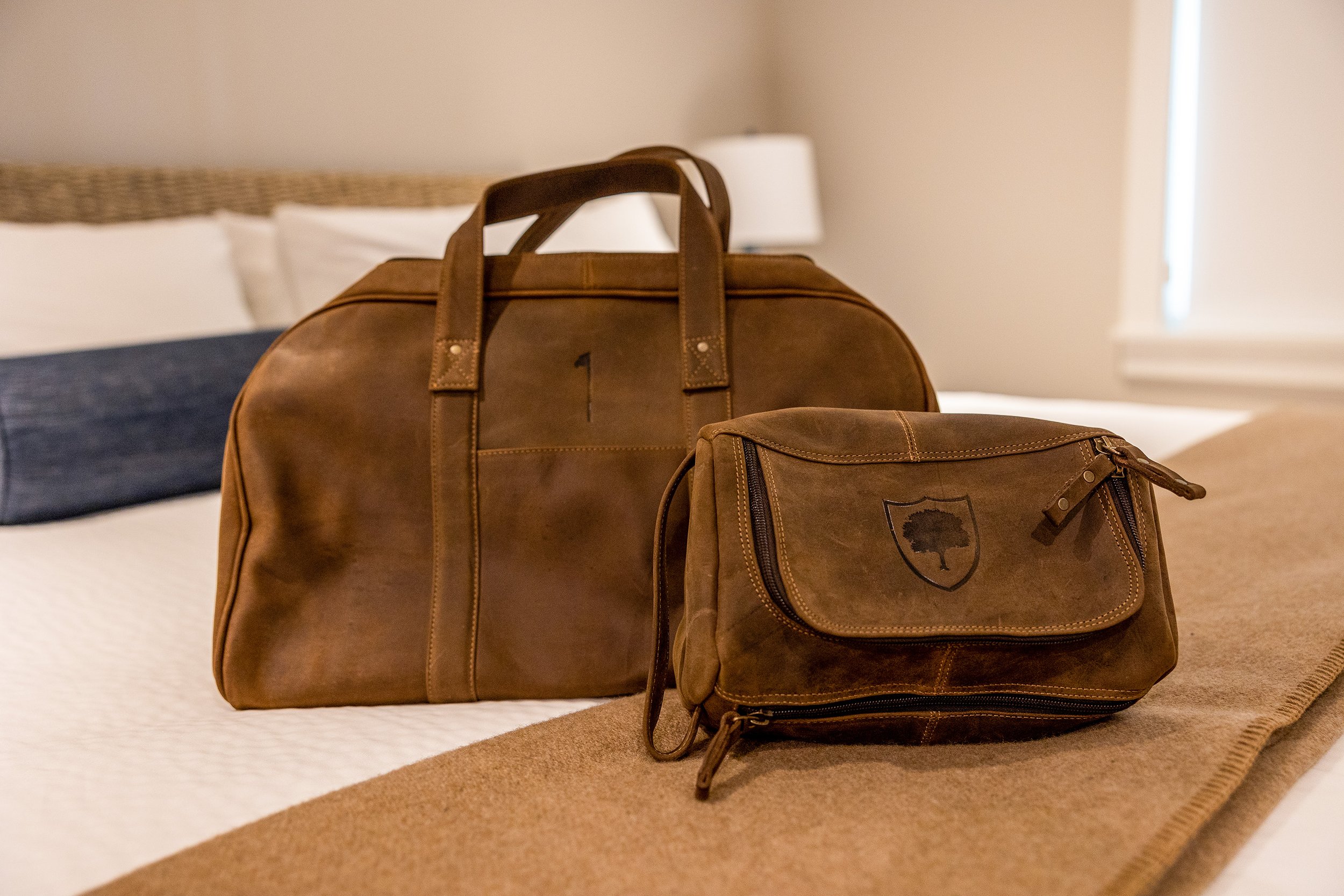 Leather bags on bed