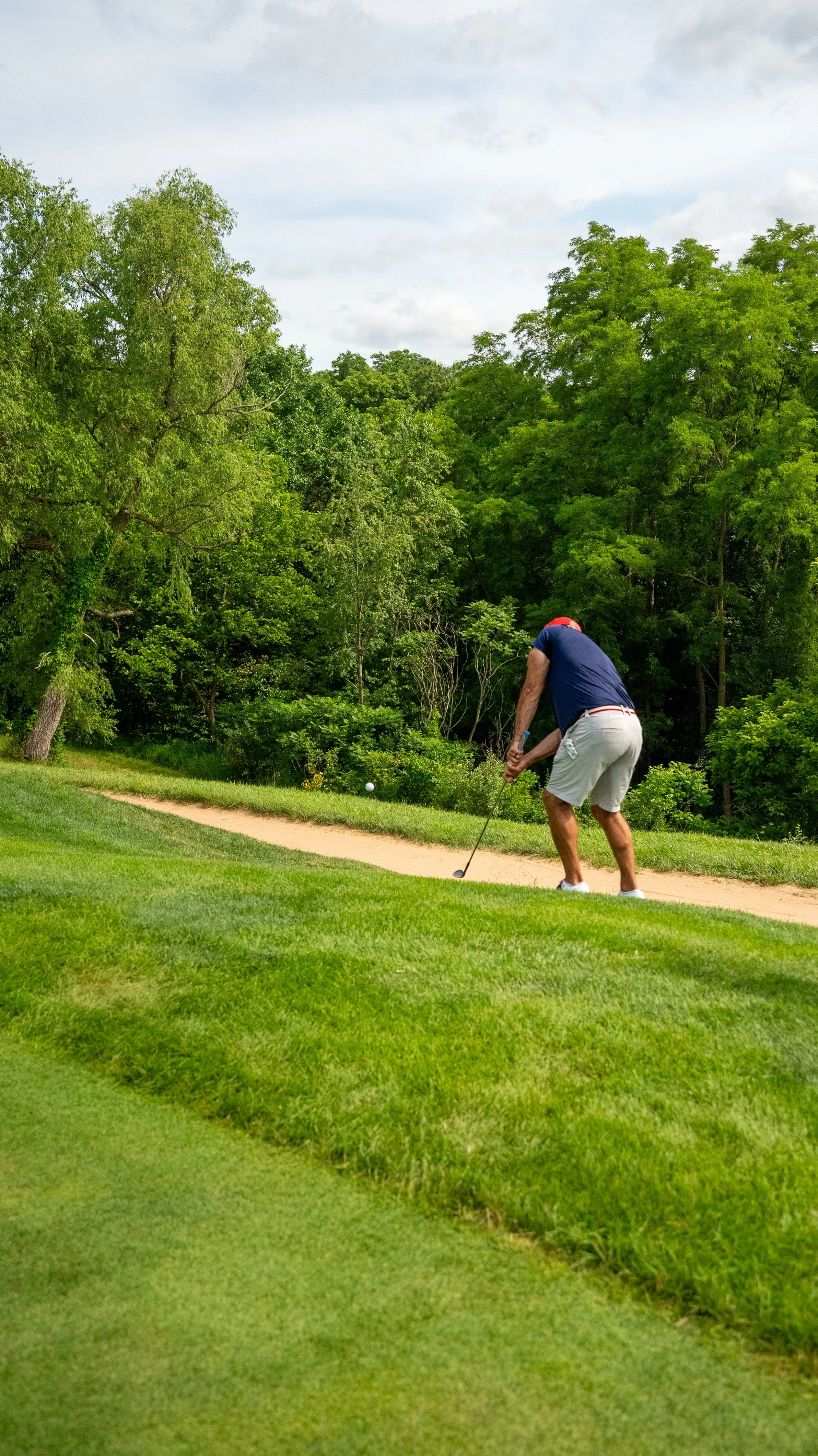 Dormie Network member chipping in at ArborLinks to win the member-guest tournament