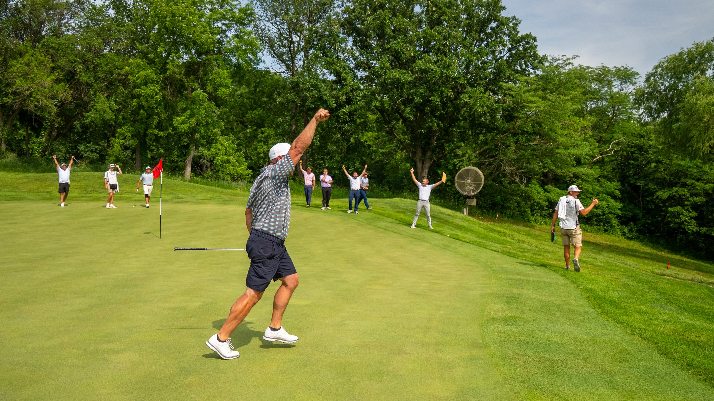 Eric Levings' partner celebrates the ArborLinks Member-Guest win
