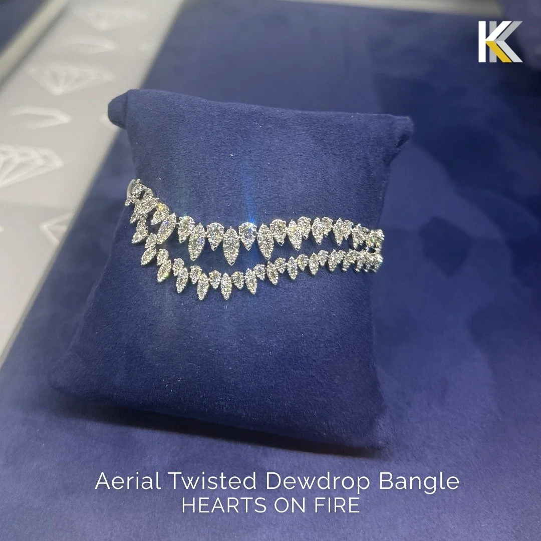 This bangle hugs all the right curves&hellip; like it knows what it&rsquo;s doing. 😏
The Aerial Twisted Dewdrop Bangle twists across your wrist with pear and marquise-shaped diamond-covered motifs that feel sculptural, bold, and a little dangerous. 