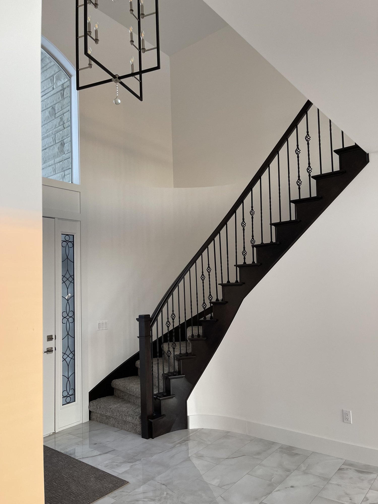 Staircase with wrought-iron balusters