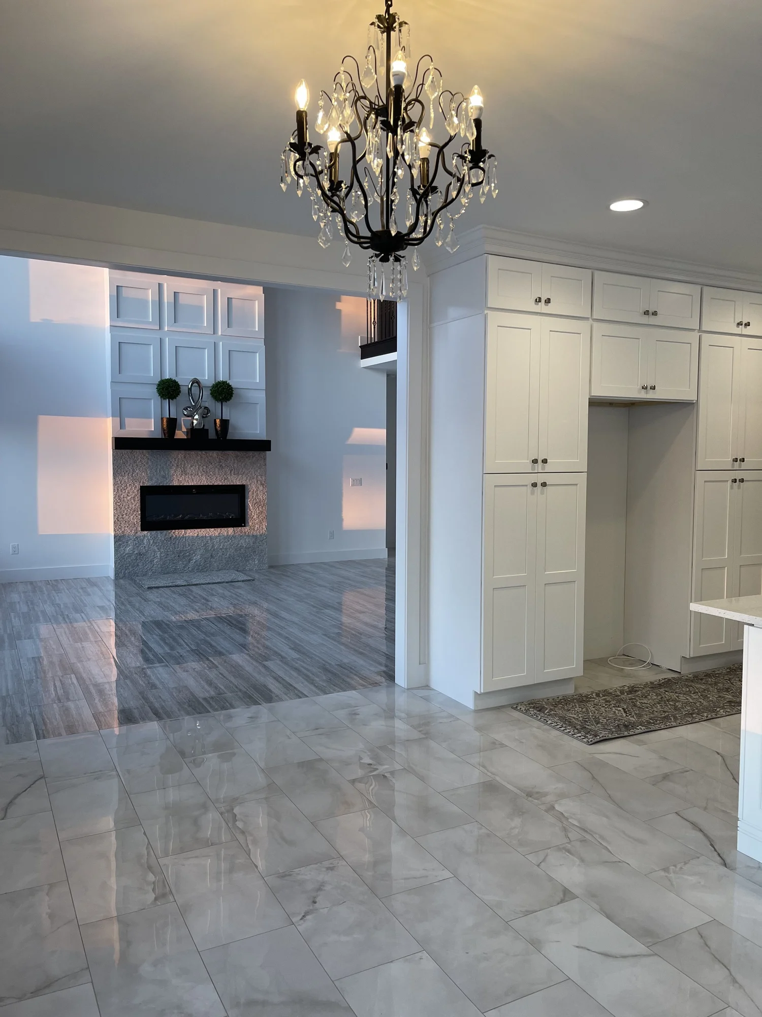 Great room with fireplace and marble tile