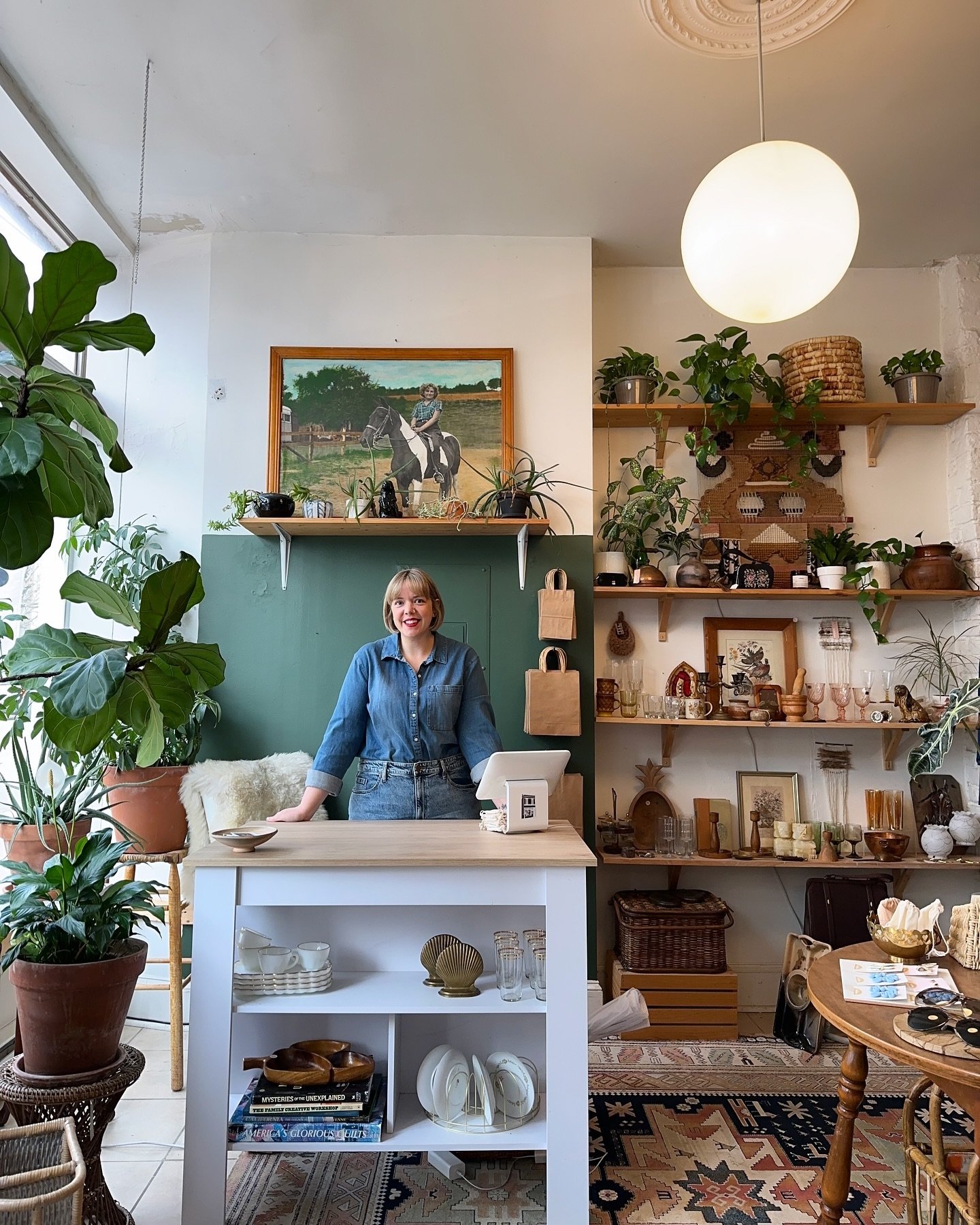 Hi! I&rsquo;m here 12-4 this weekend. Here&rsquo;s my face because I heard the algorithm likes that? The new checkout stand spot is great for people watching and I&rsquo;m closer to my plants, 10/10