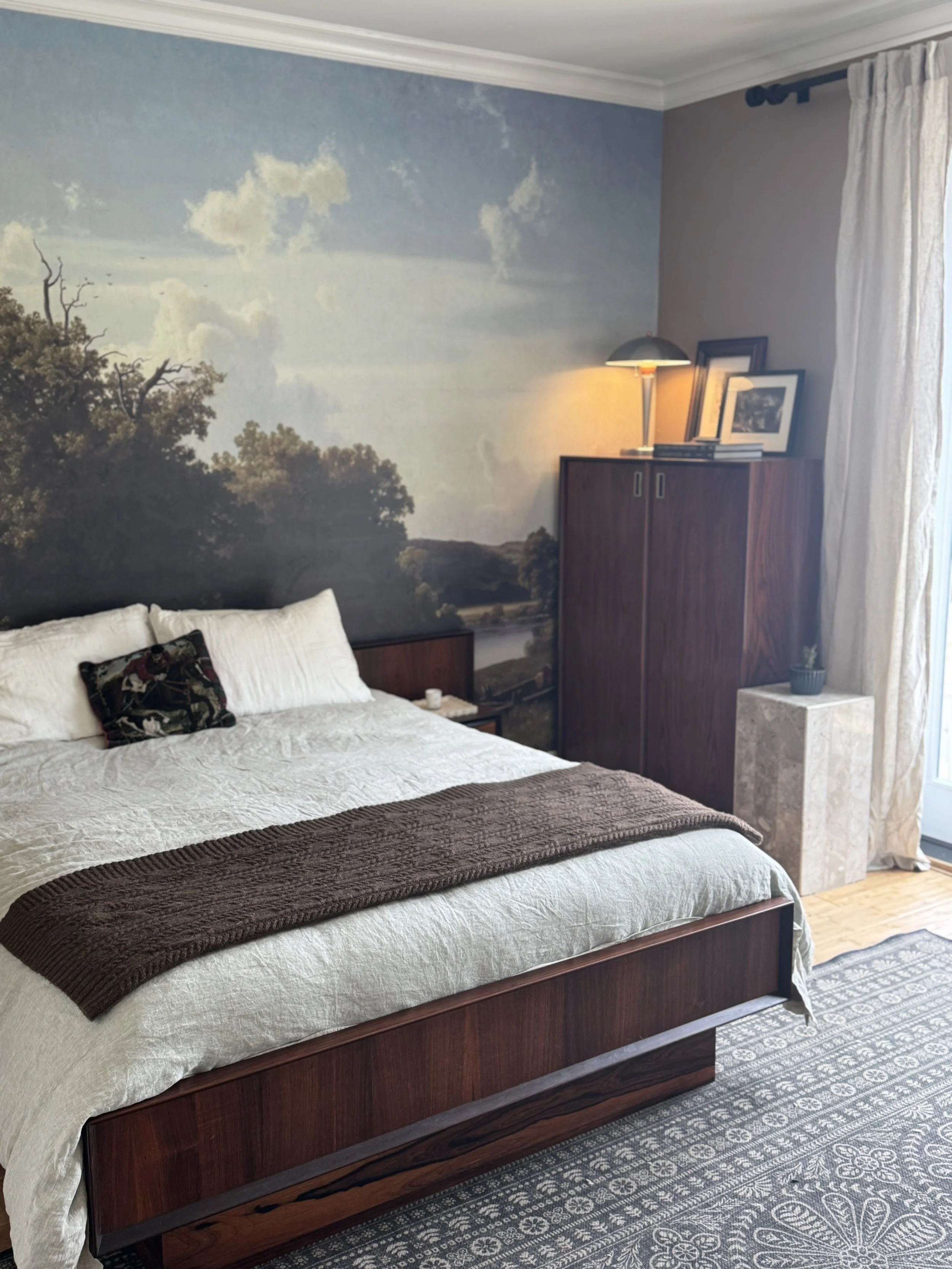 A bedroom renovation with a $400 budget, including bed-frame, mattress, wallpaper cabinets, rugs, and light fixtures.