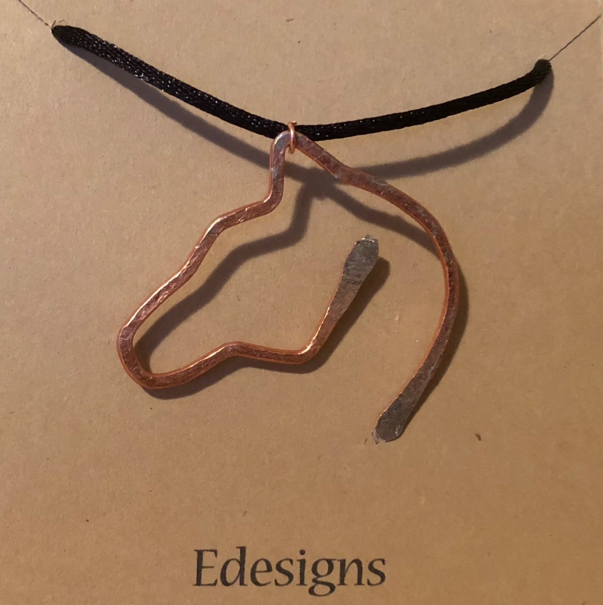 I founded my jewelry brand, EDesigns, when I was 15, and it continues to be part of my creative work today. The brand focuses on handcrafted, wire-wrapped stones and small sculptural pieces.