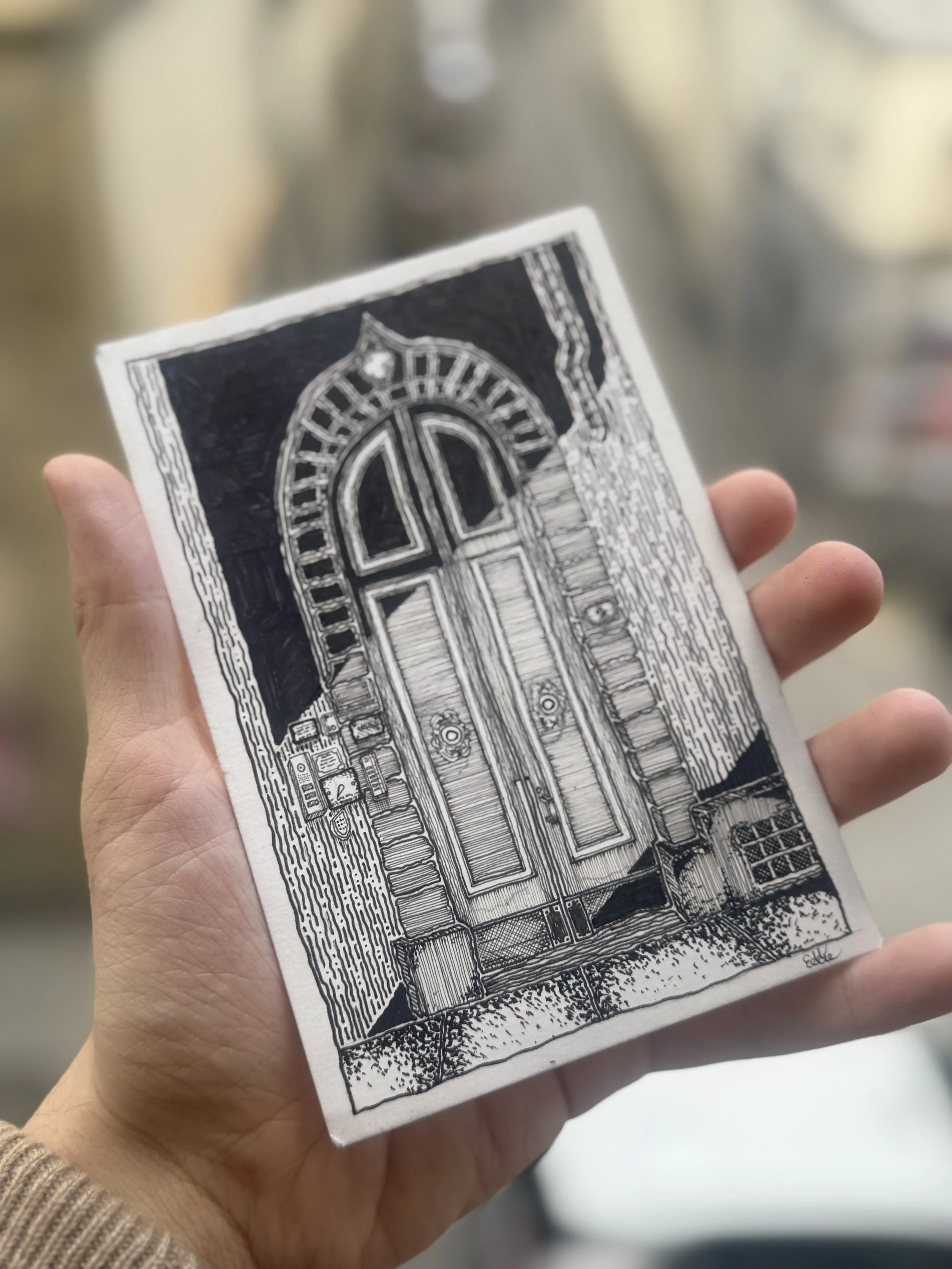 The picture of my front door taken outside of it on a postcard meant to give to friends and family.