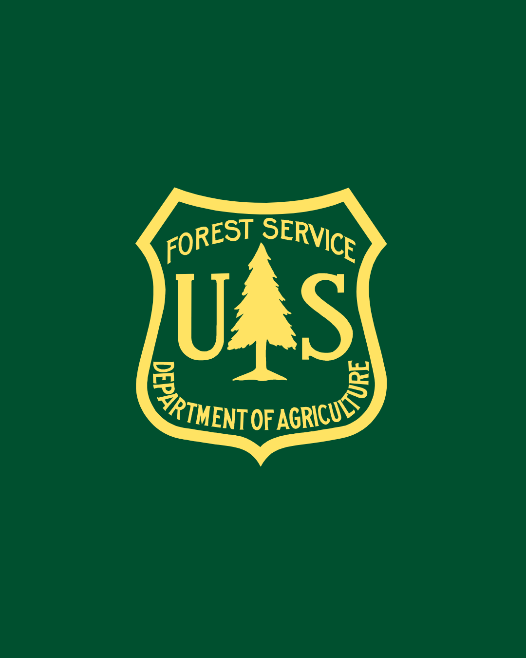 U.S. Forest Service shield emblem on green background