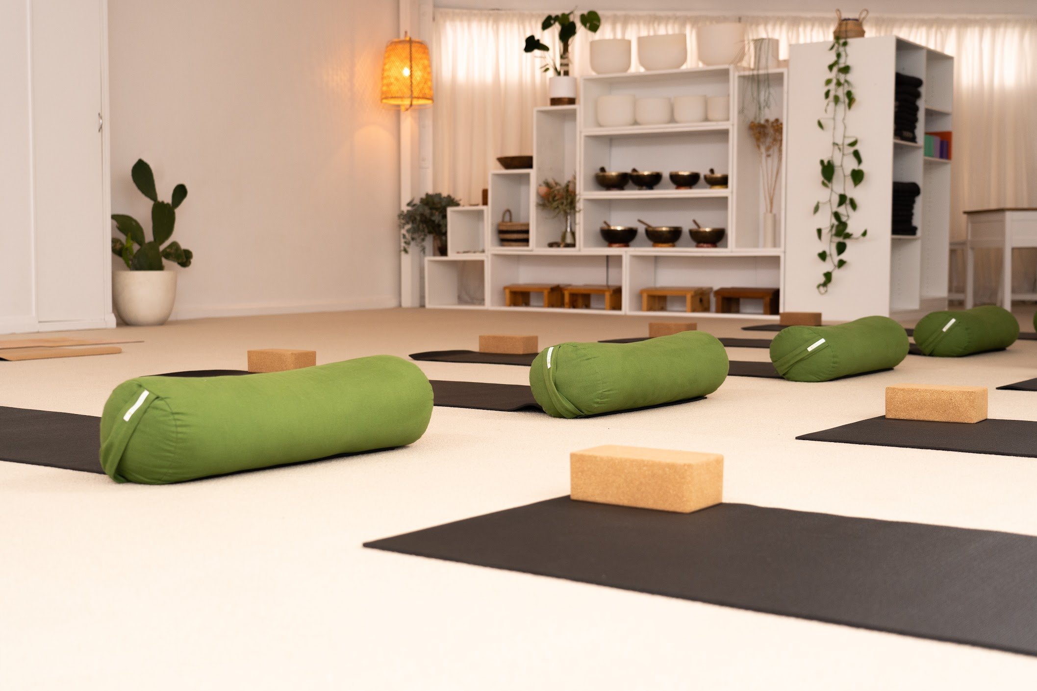 HUM Studio Dee Why in the Northern Beaches, yoga mats, bolsters and blocks set up for a yoga or pilates class