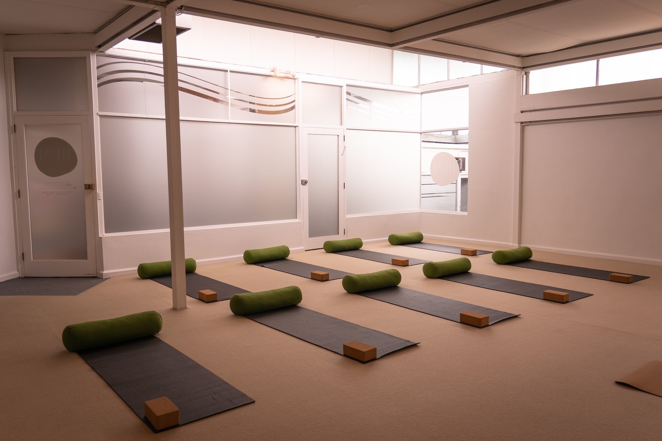HUM Studio Dee Why in the Northern Beaches, yoga mats, bolsters and blocks set up for a yoga or pilates class