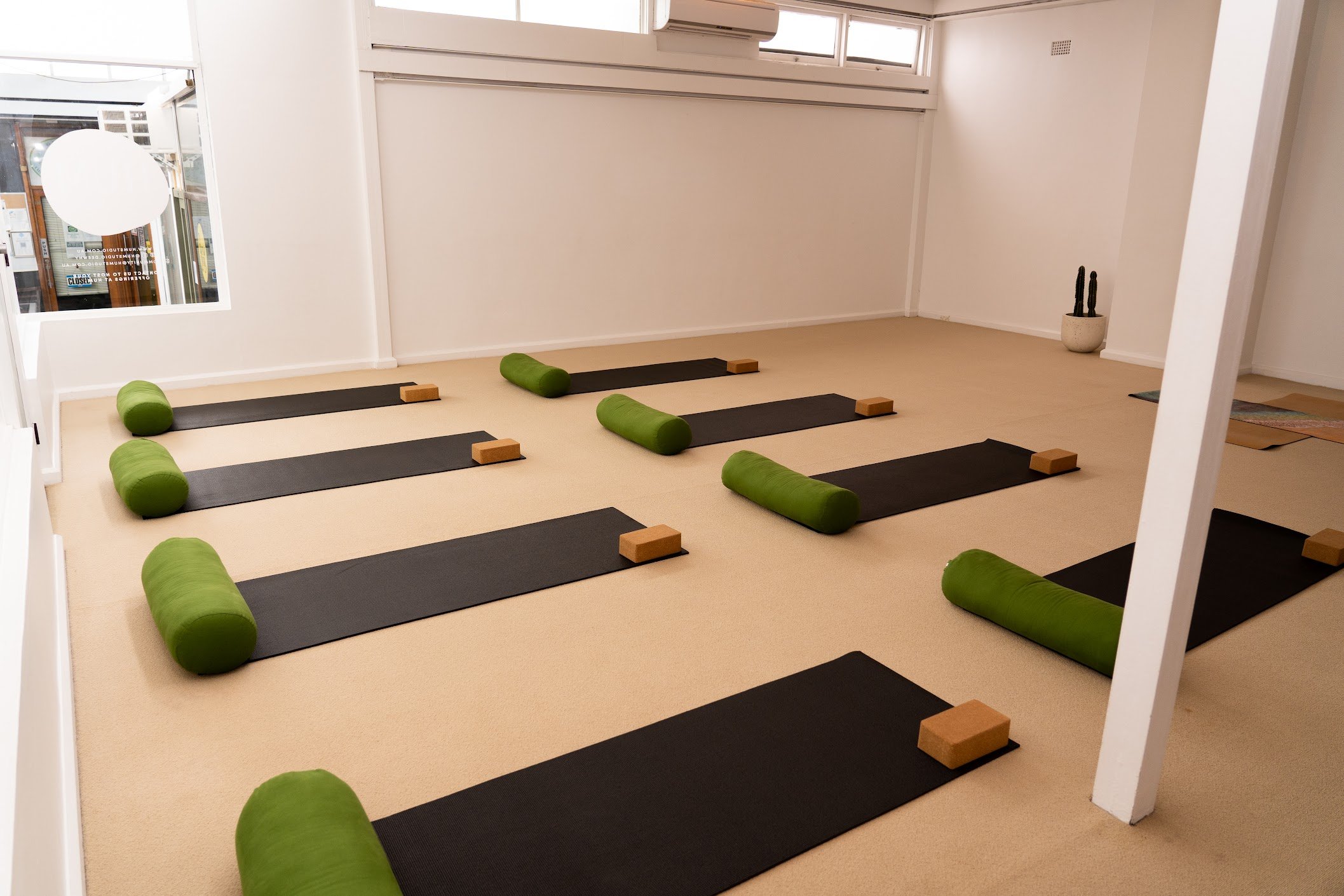 HUM Studio Dee Why in the Northern Beaches, yoga mats, bolsters and blocks set up for a yoga or pilates class
