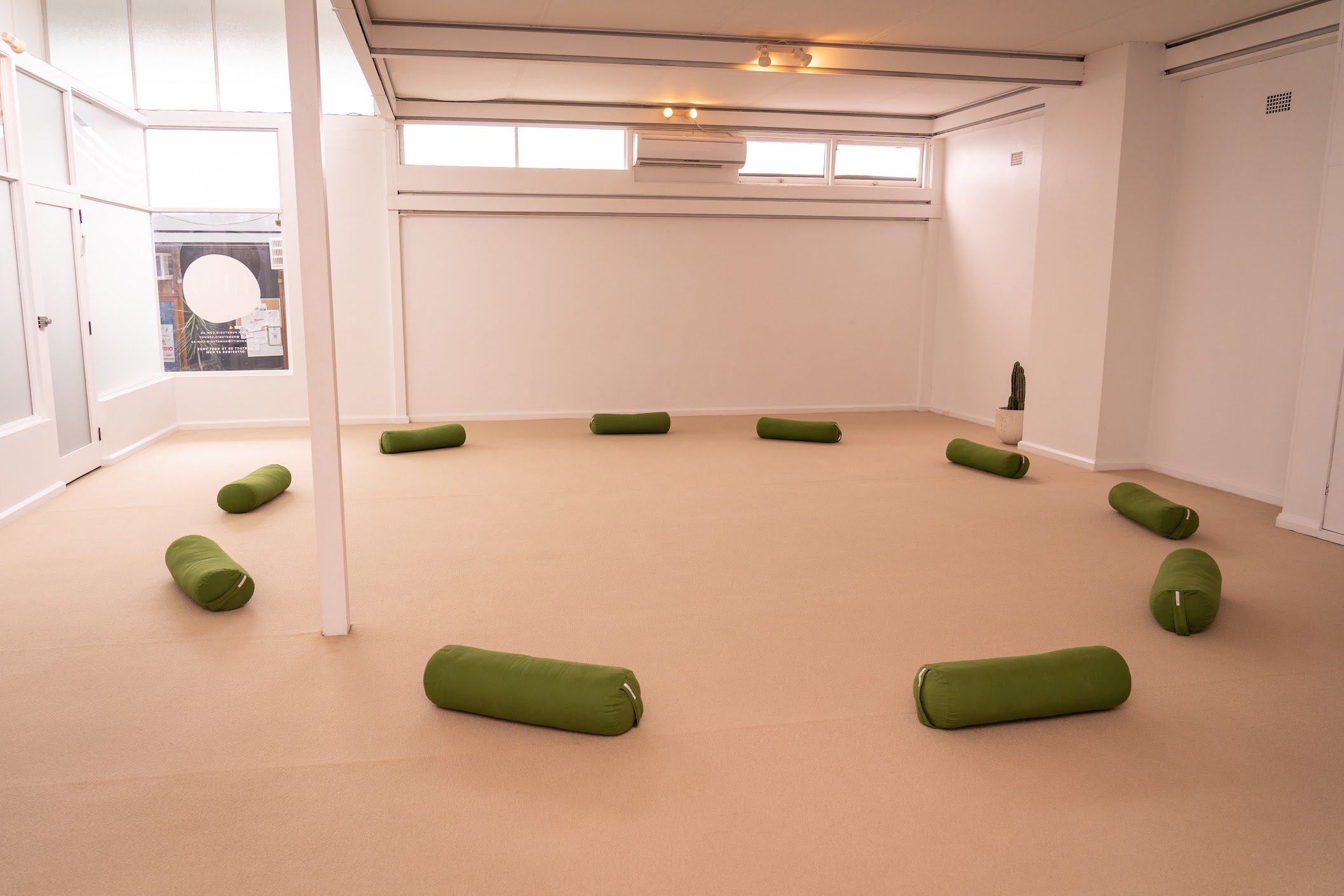 HUM Studio Dee Why in the Northern Beaches, bolsters set up for a meditation or medicine circle for support