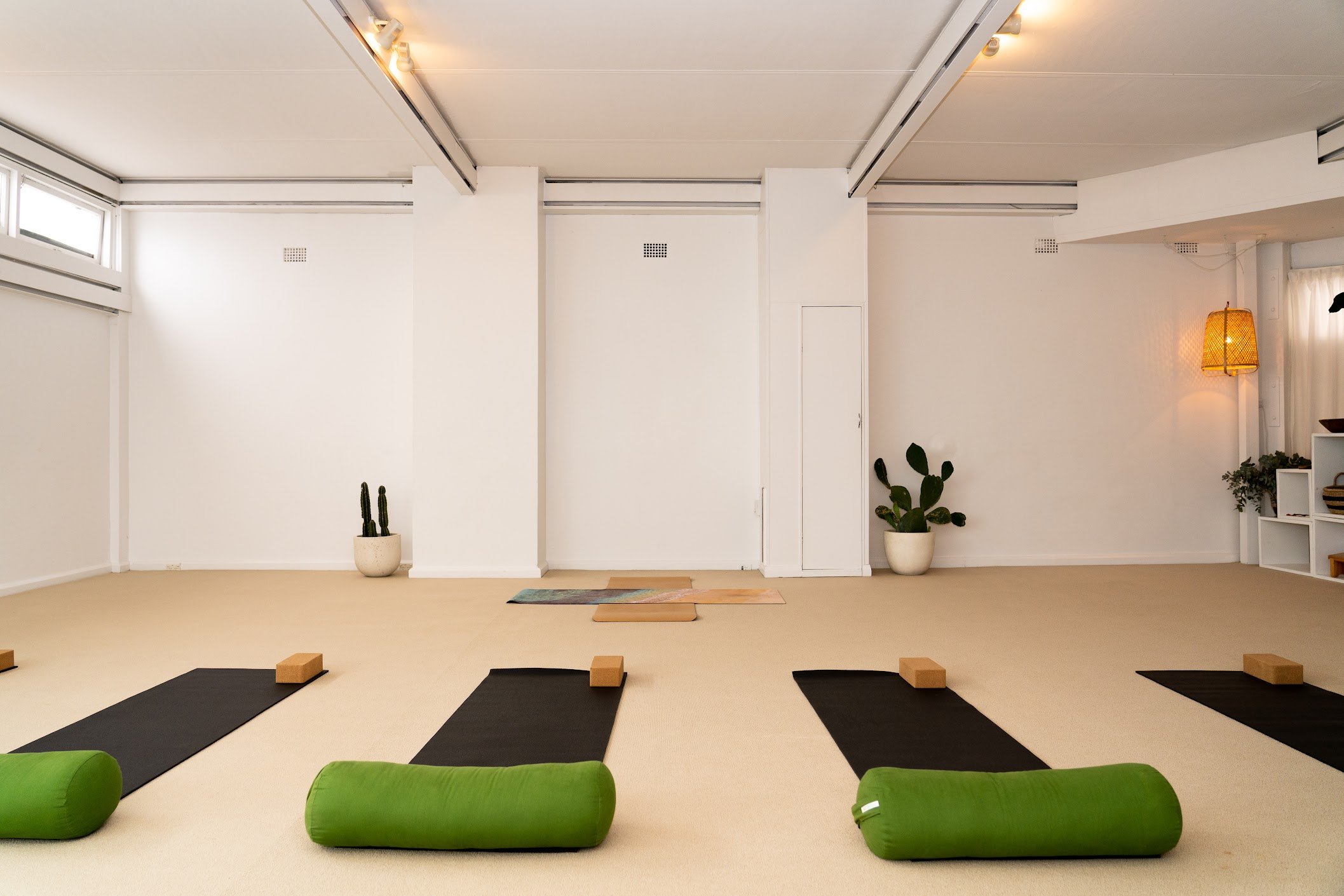 HUM Studio Dee Why in the Northern Beaches, yoga mats, bolsters and blocks set up for a yoga or pilates class