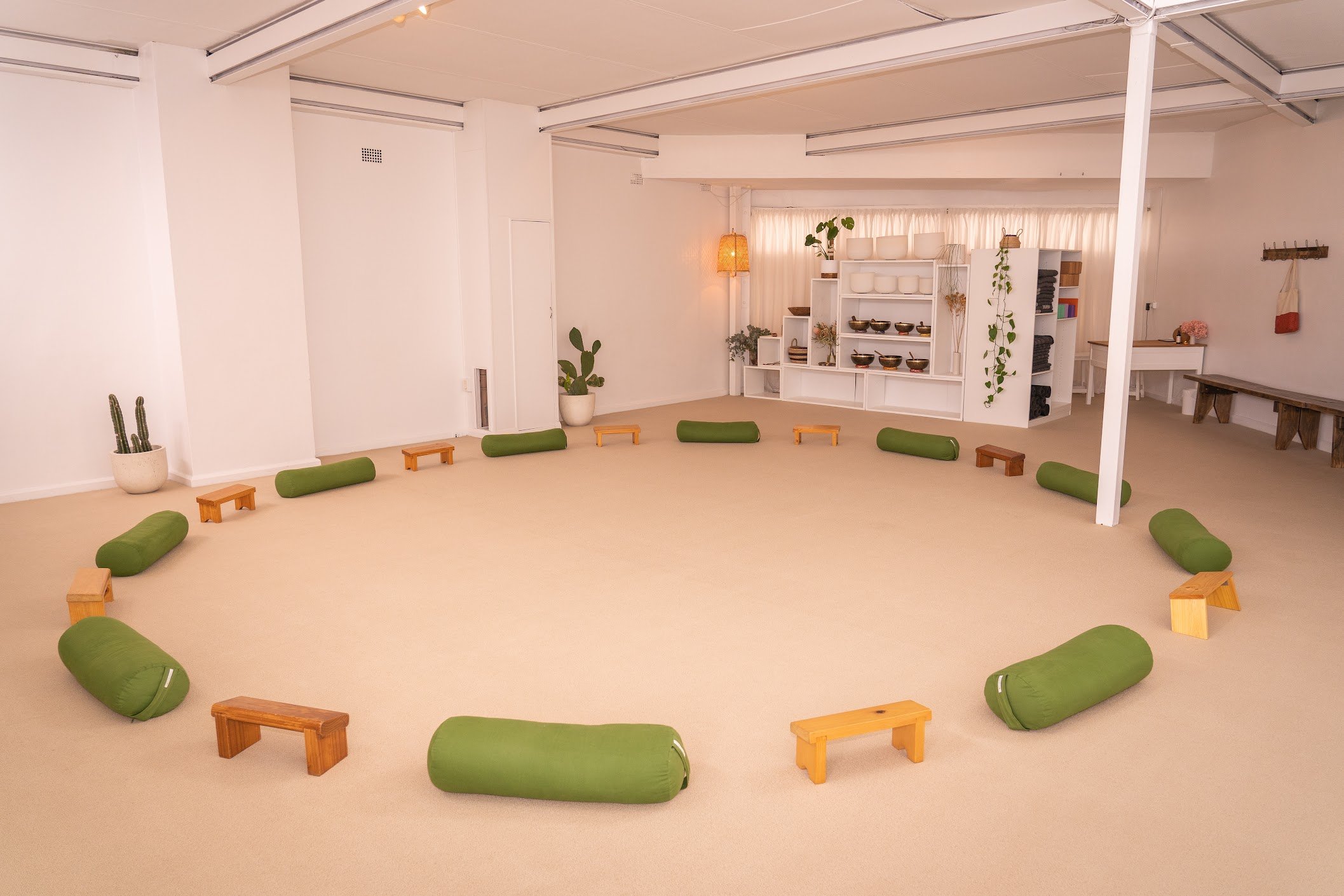 HUM Studio Dee Why in the Northern Beaches, bolsters and meditation stools set up for a meditation or medicine circle for support