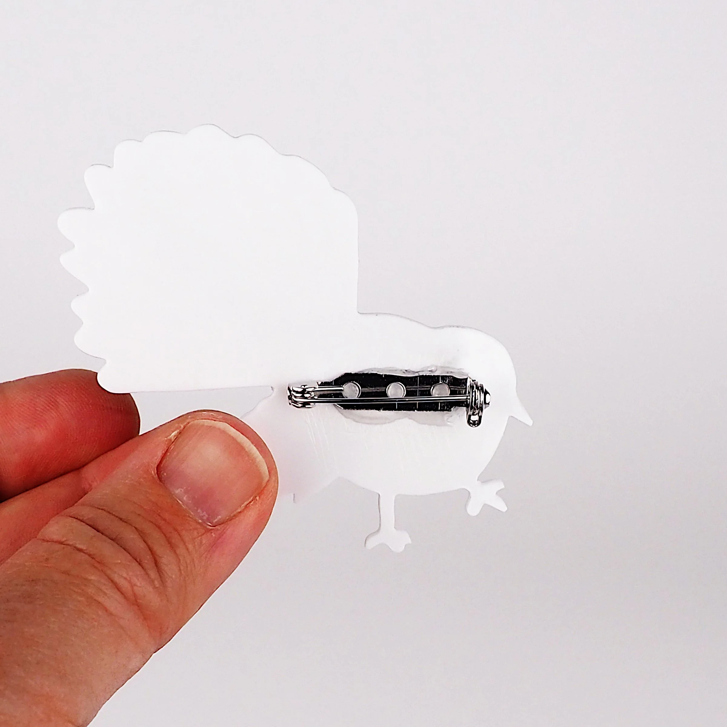 piwakawaka in hand back.JPG