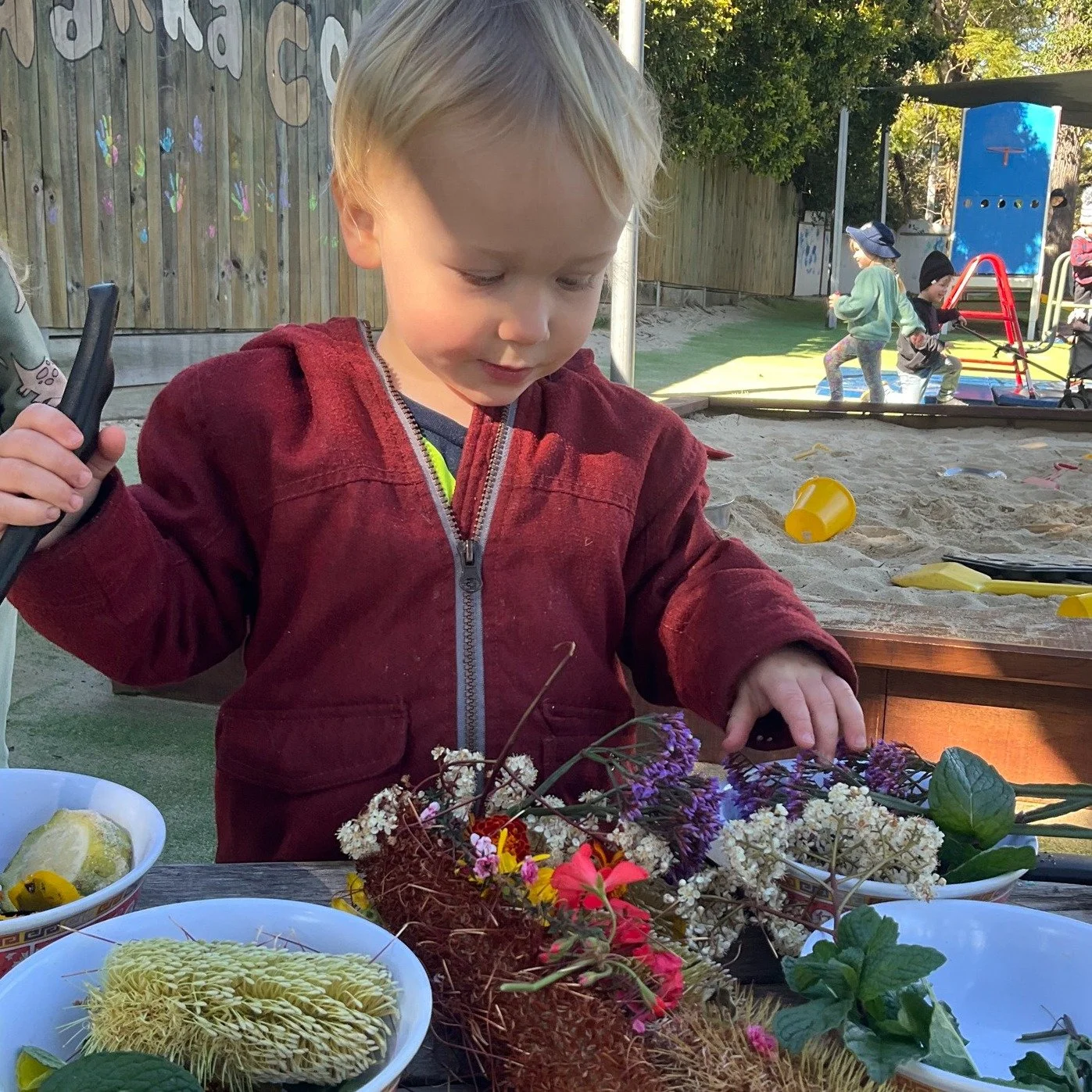 Our playground turned into a garden kitchen! With bowls, spoons and baskets of petals, we mixed up colourful soups, decorated cakes, and invented recipes only the most imaginative could dream up. The air was filled with giggles, chatter and the sweet