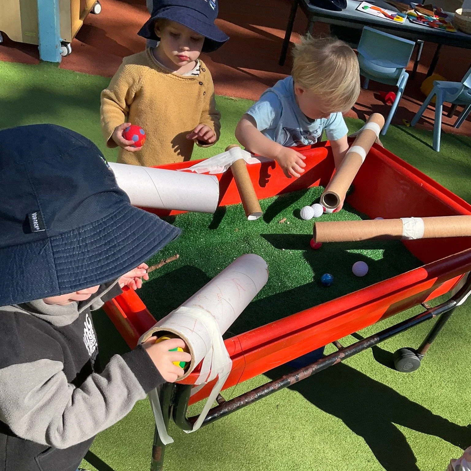 We turned our table into a pipe track! By attaching pipes and sending balls down each one, we watched with excitement as they zoomed, bounced and rolled in all different directions. The giggles grew louder with every surprise. Sometimes the balls fle