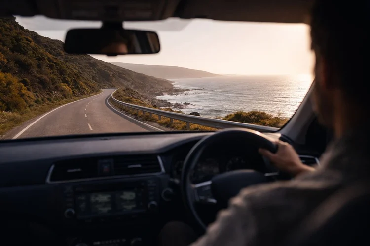 A scenic coastal road in Britain with sea views and open sky