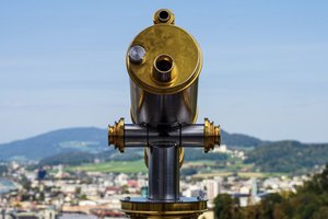 A telescope at a scenic viewpoint overlooking the landscape