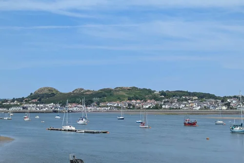 Conwy harbour views with castle walls and historic waterfront during a North Wales road trip