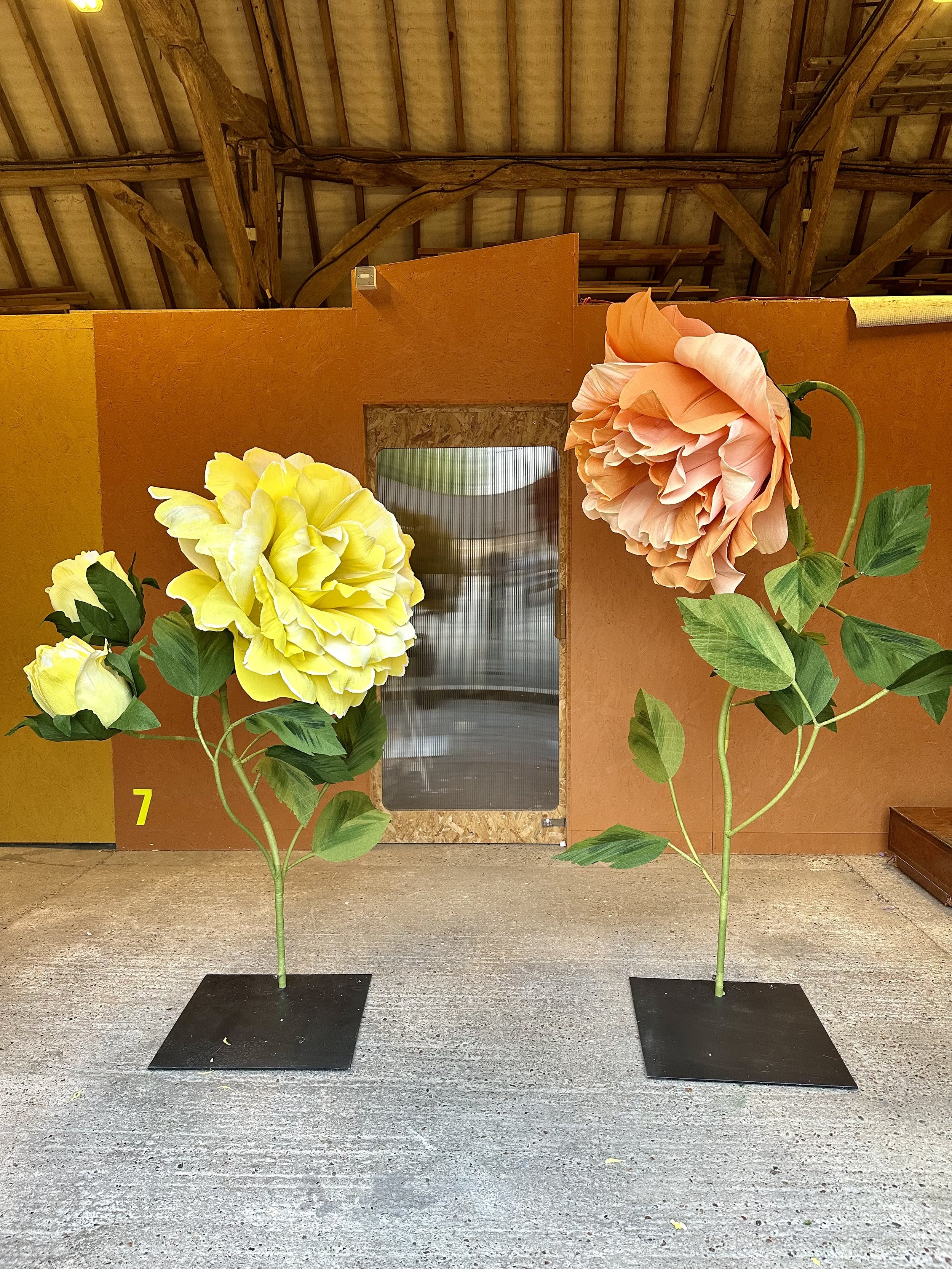 Giant handmade paper roses for window display